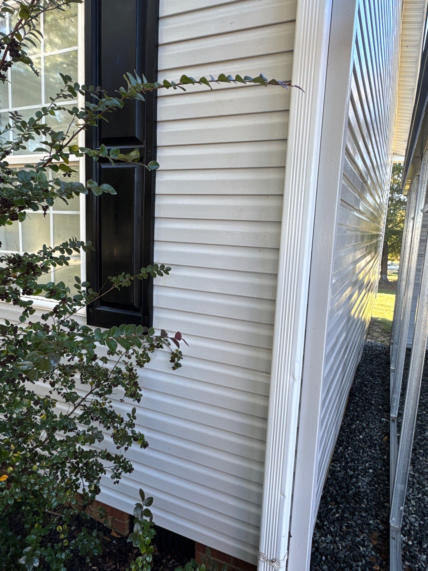 the service being done is cleaning the vinyl siding of the house to remove dirt and grime buildup