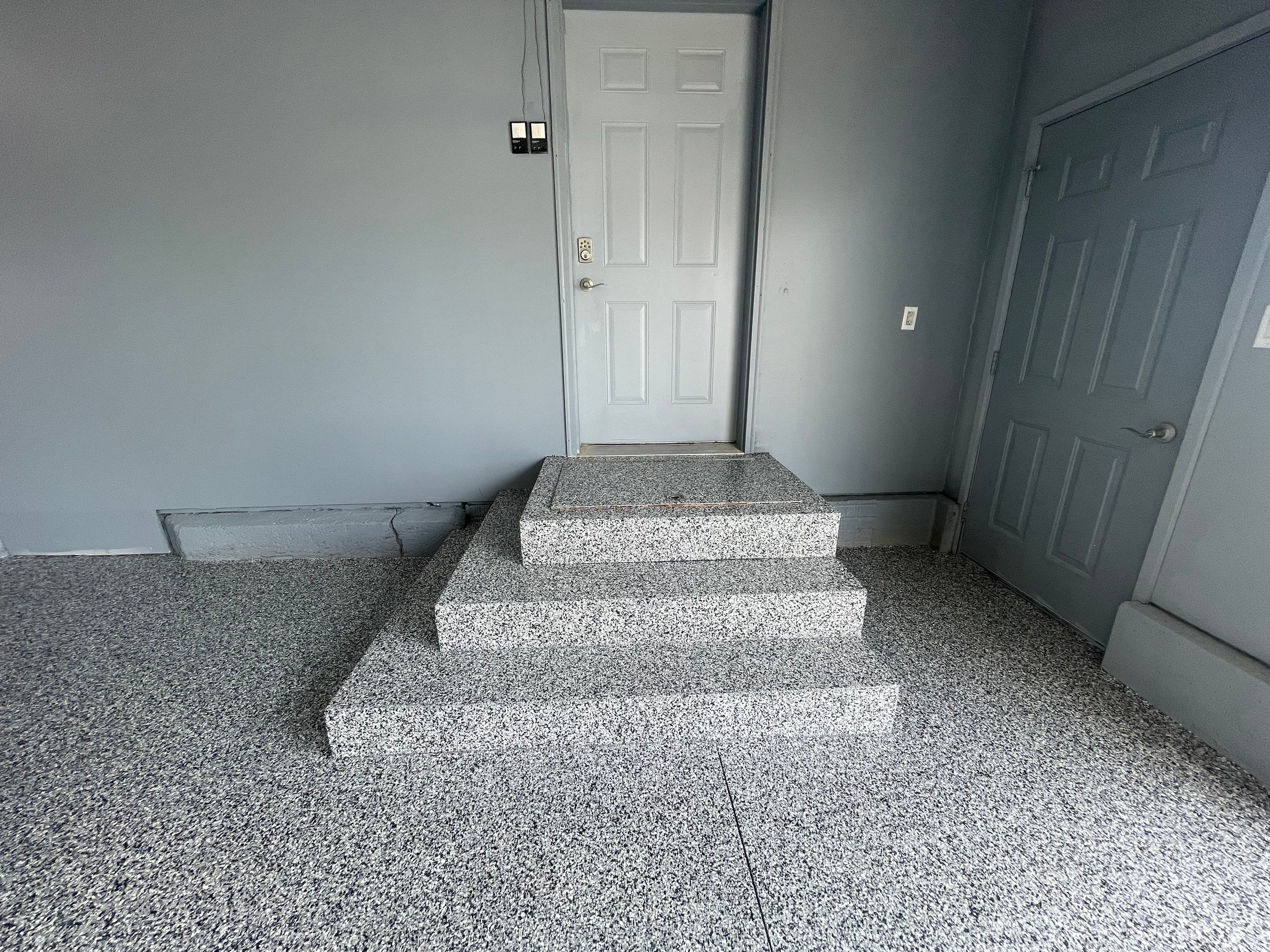Grey Granite-Style Garage Floor Coating and Stairs in Hartford by Select Painting, Coatings & Garage Cabinets