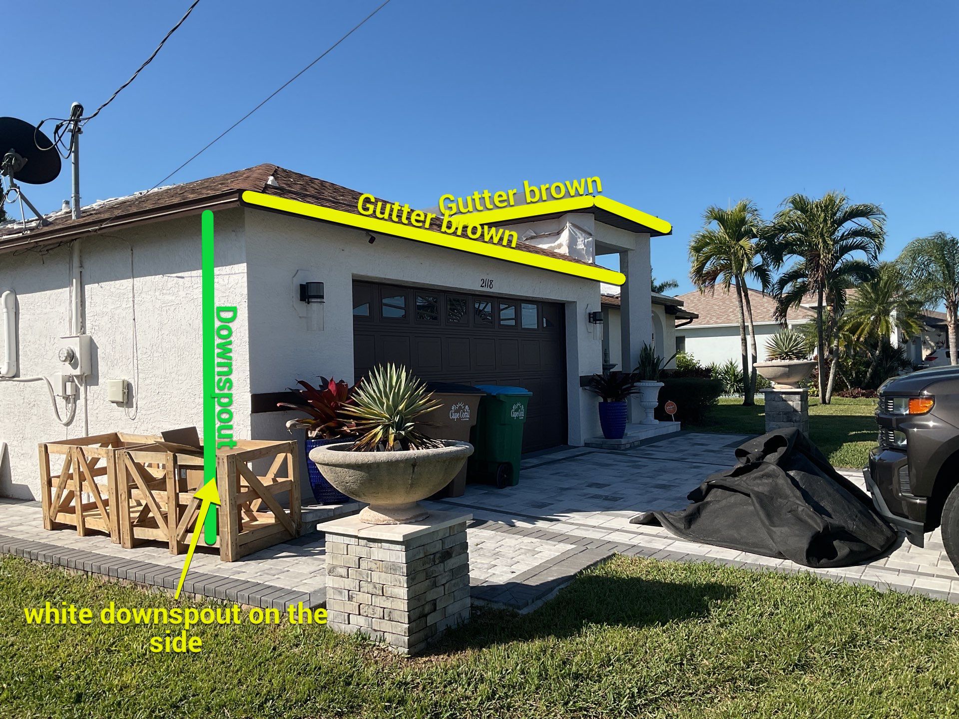 Brown Gutter + White and Brown Downspouts in Cape Coral FL by Gutter Professors
