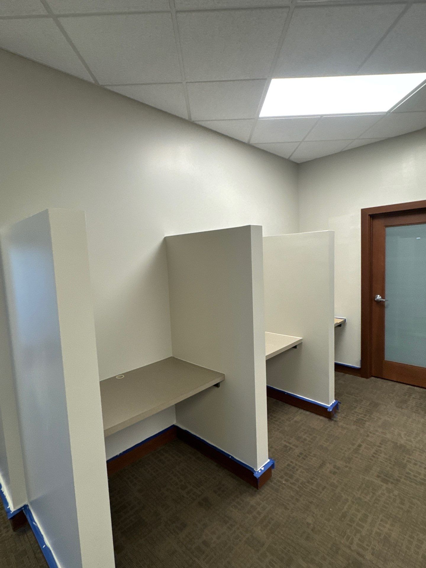 Commercial Office Interior Remodel and Modern Suite Refresh in Sioux Falls by Select Painting, Coatings & Garage Cabinets