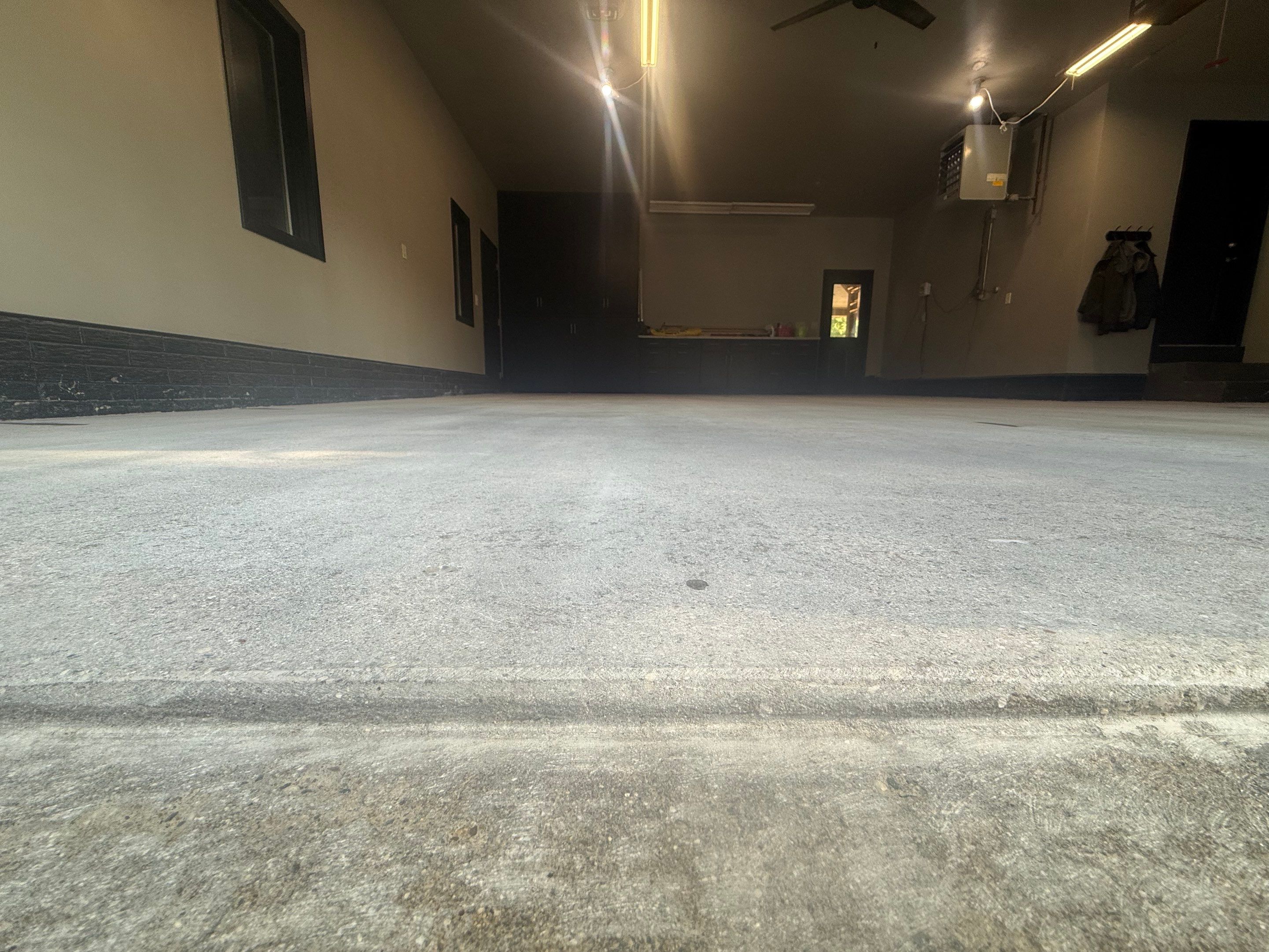 Garage Floor and Textured Pool Deck Coating in Sioux Falls by Select Painting, Coatings & Garage Cabinets