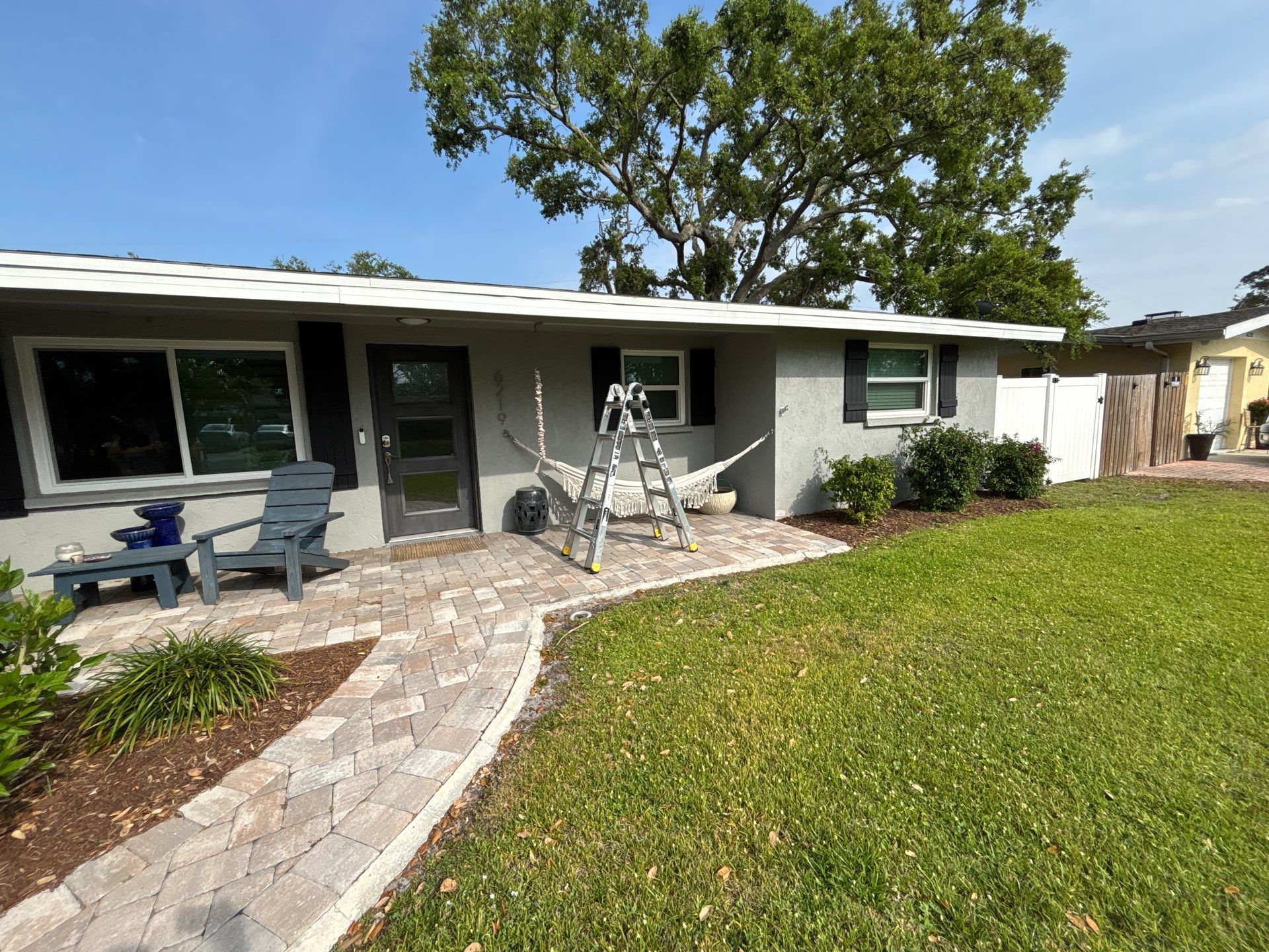Black Seamless Gutters using 7 inch seamless gutters & New White Soffit in Sarasota FL by Gutter Professors