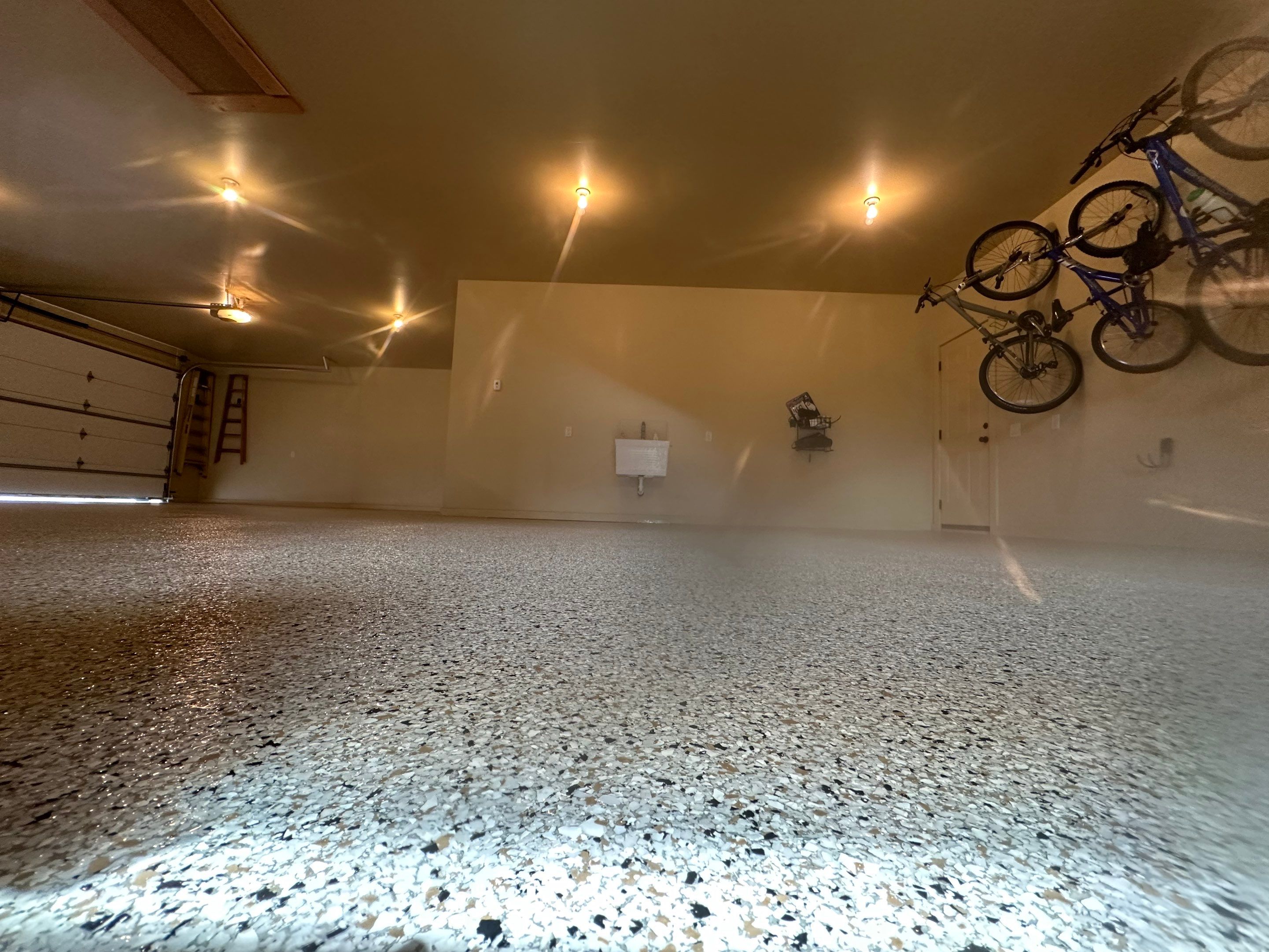 Sioux Falls Garage Floor Concrete Coating with Shoreline Flake Finish by Select Painting, Coatings & Garage Cabinets