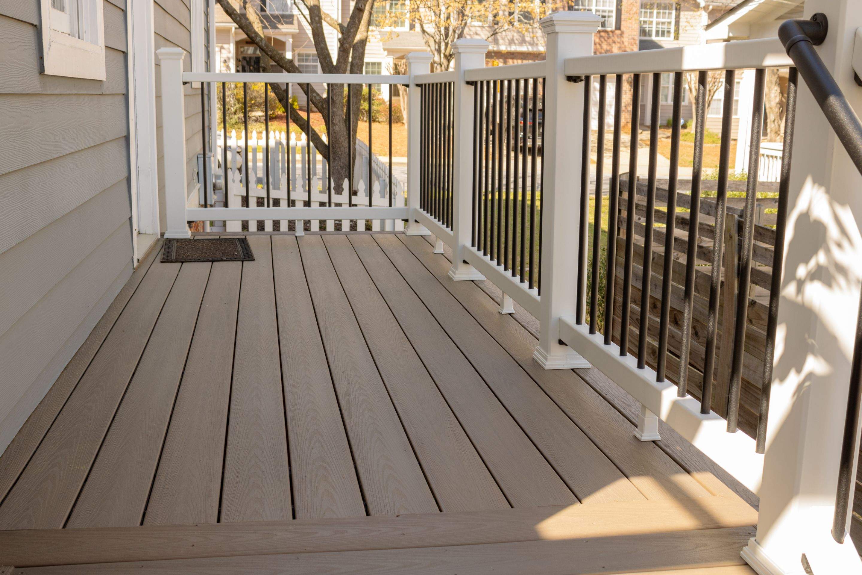 Atlanta, GA Deck Rebuild and Pergola Build using Deckorators Venture Series Decking, Trex Composite Railing, and Pressure Treated Pine by Nelson Exteriors 