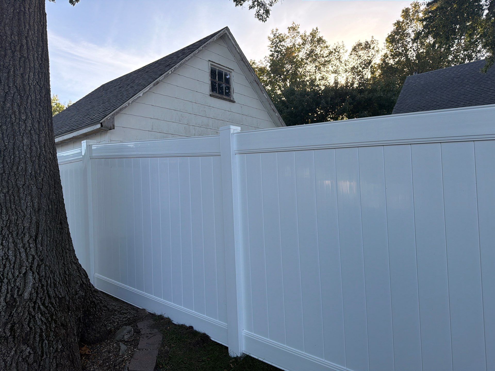 White Vinyl Privacy Fence and Gate Installation in Grundy Center by Perfect Picket Fence and Stain