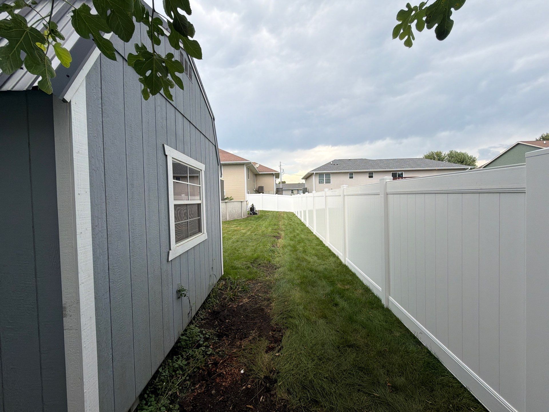 White Vinyl Privacy Fence Installation in Raymond, IA by Perfect Picket Fence and Stain