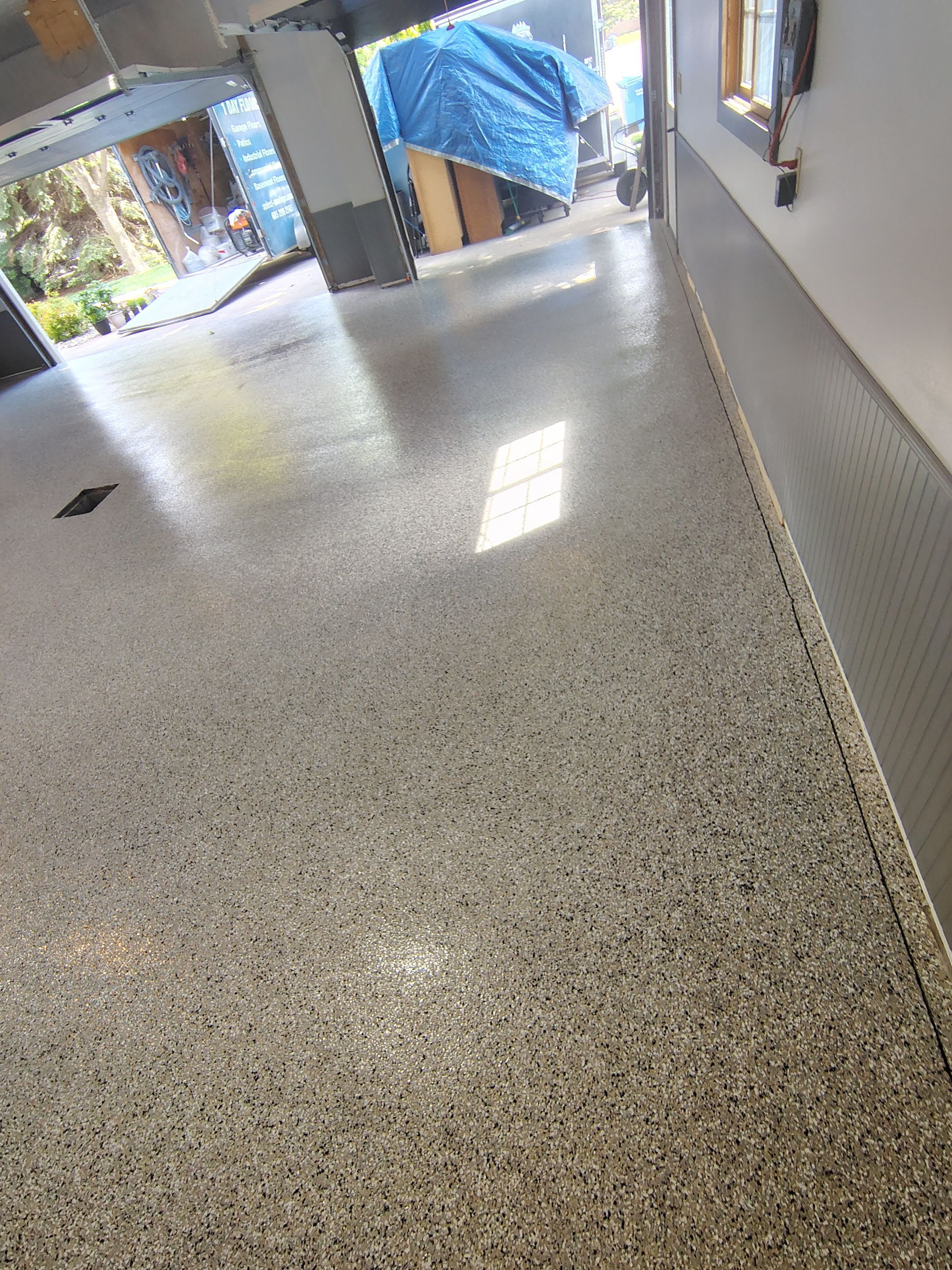 Multi-Fleck Epoxy Garage Floor Coating in Dell Rapids by Select Painting, Coatings & Garage Cabinets