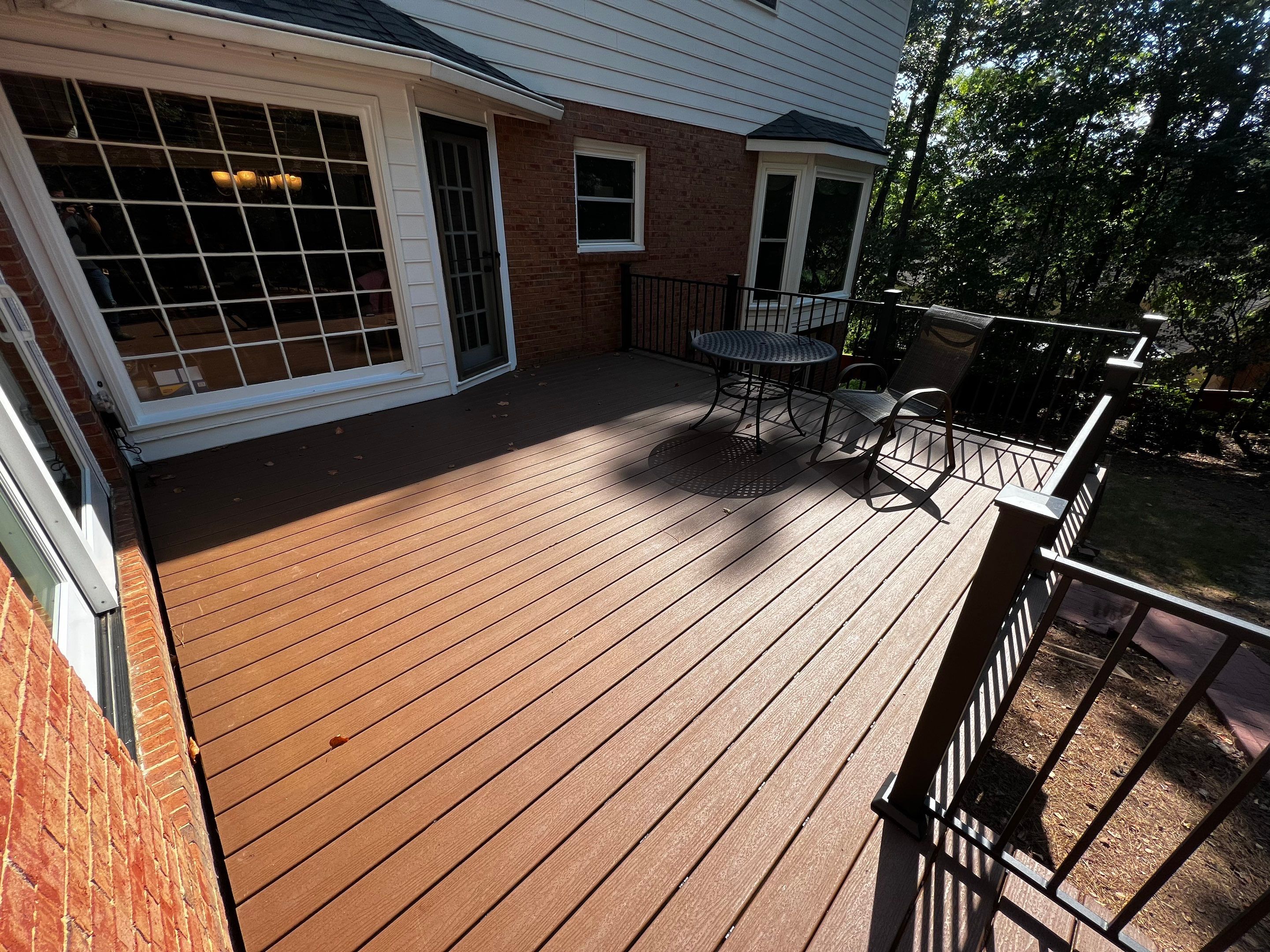 Elevated Composite Deck Installation with Metal Railings in Atlanta by Swift Home Renovations