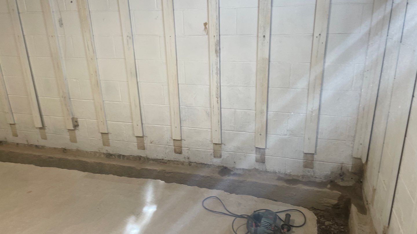 Interior Drain Tile & Buried Discharge in St. Anthony, MN by Waterproofing Northeast