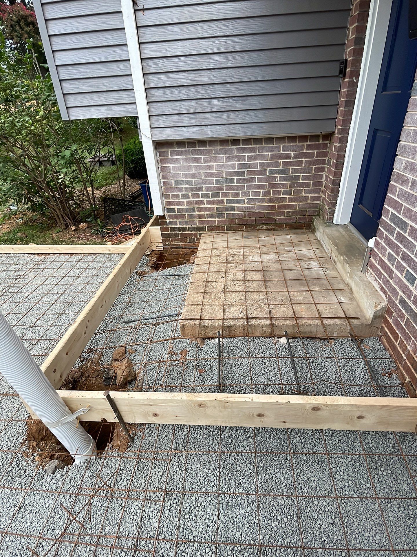 New walkway with stairs and a new front porch by Fairfax Contractors, LLC