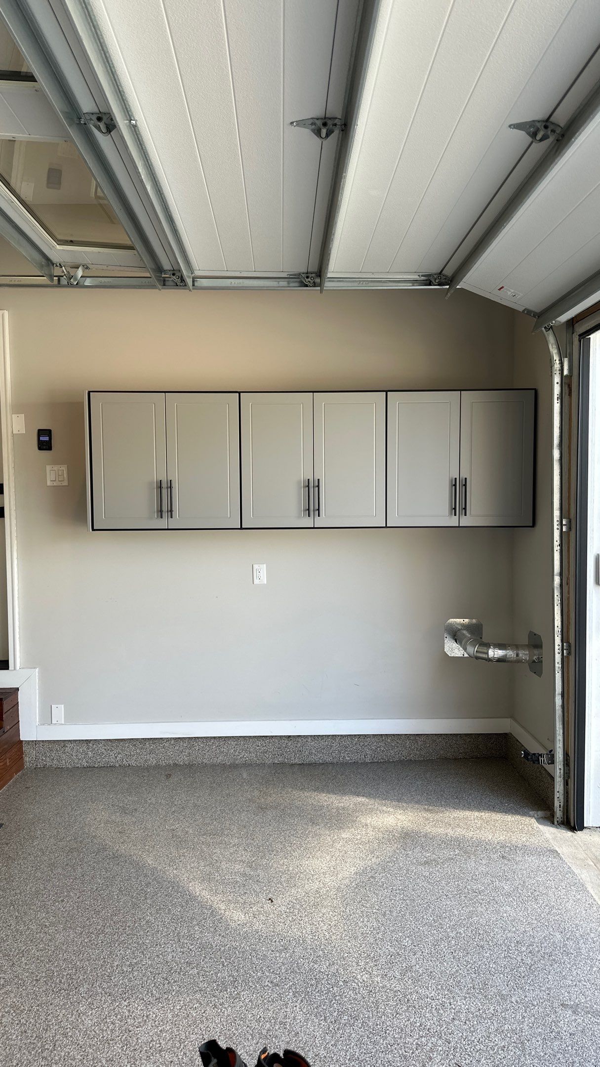 Robert B. upgraded his garage with cabinets and slotwall   by Banner Garage