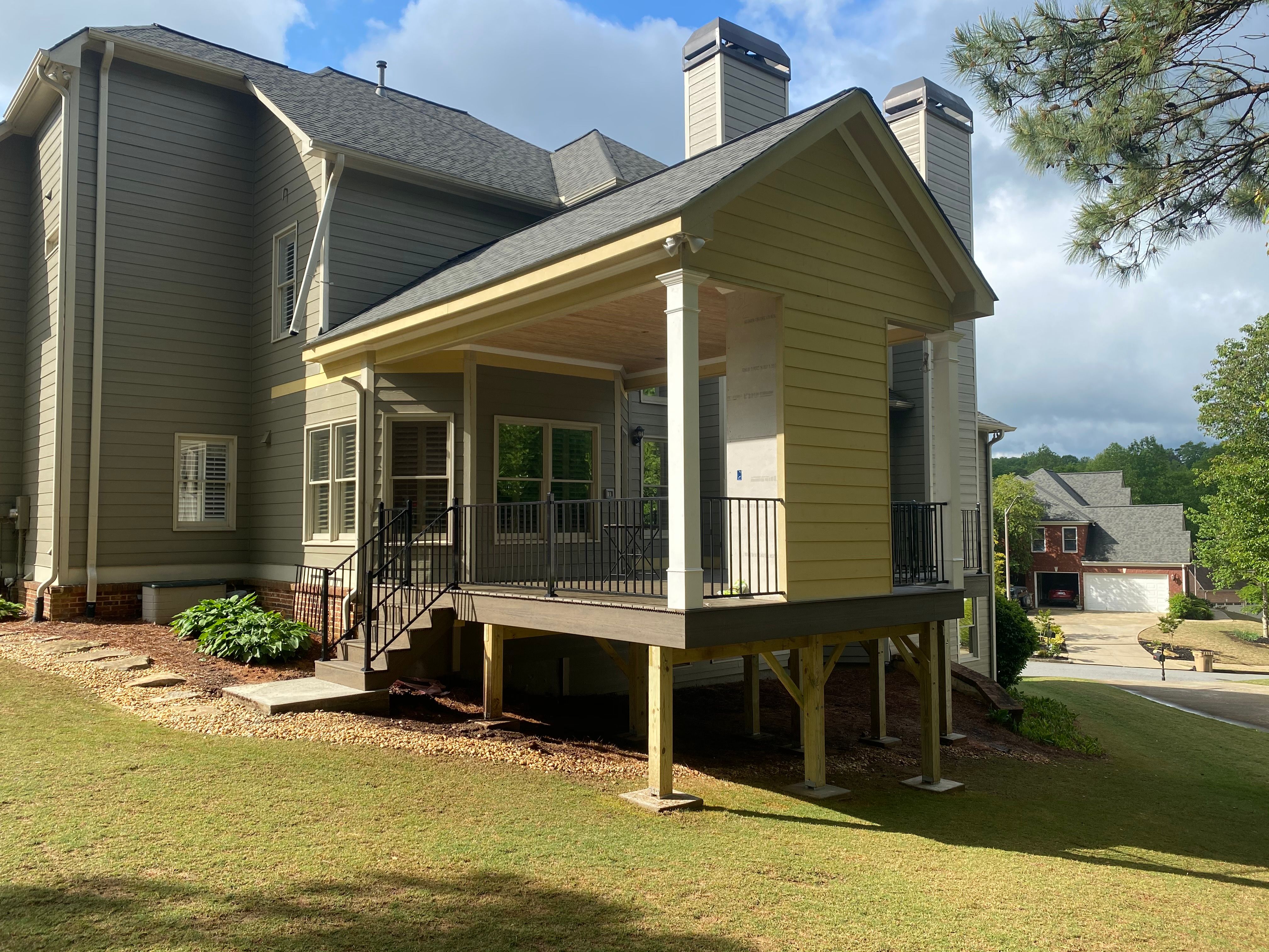 Covered Porch and Composite Deck Addition in Woodstock by Swift Home Renovations