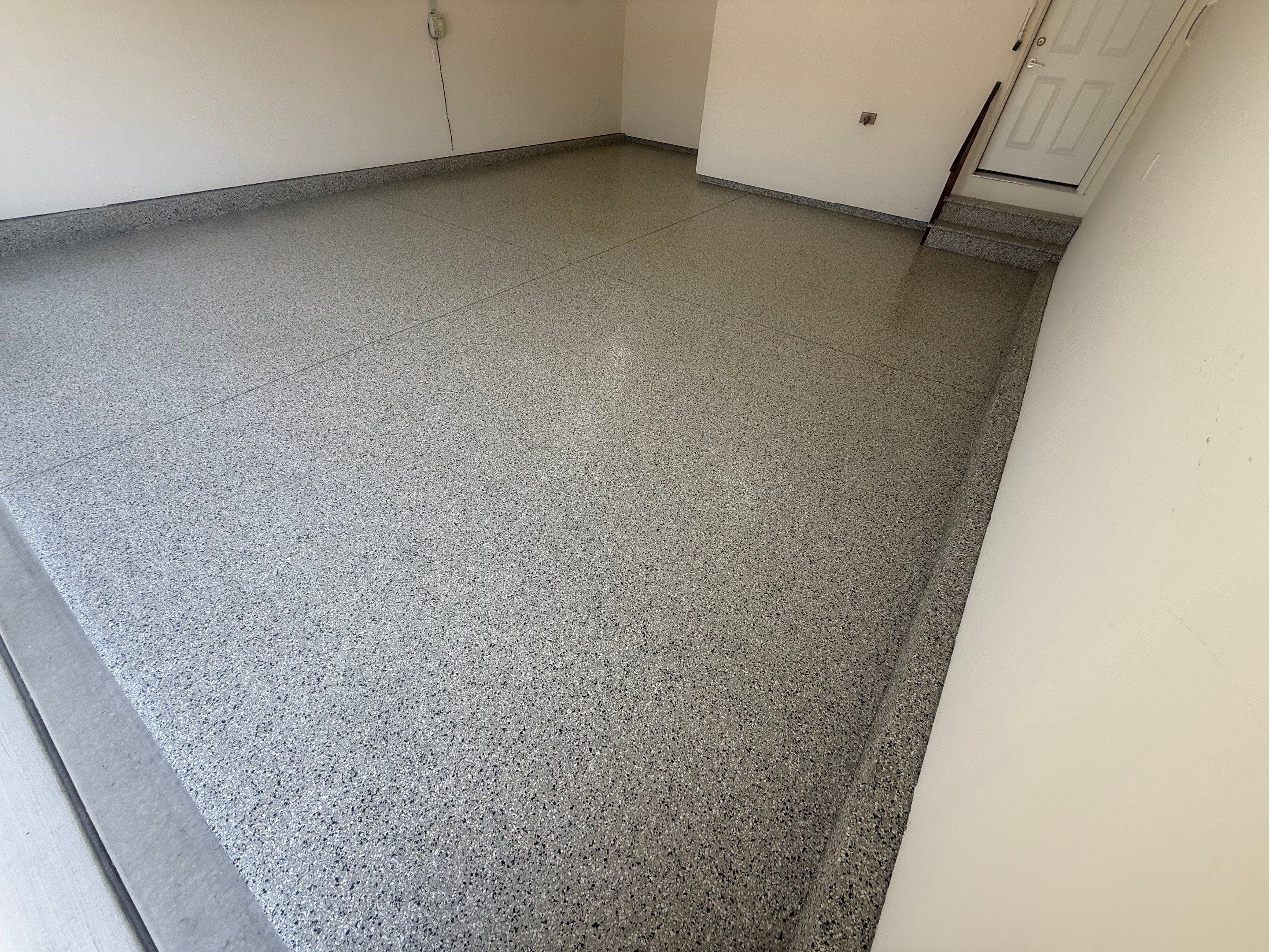 Cabin Fever Garage Floor Coating in Sioux Falls by Select Painting, Coatings & Garage Cabinets