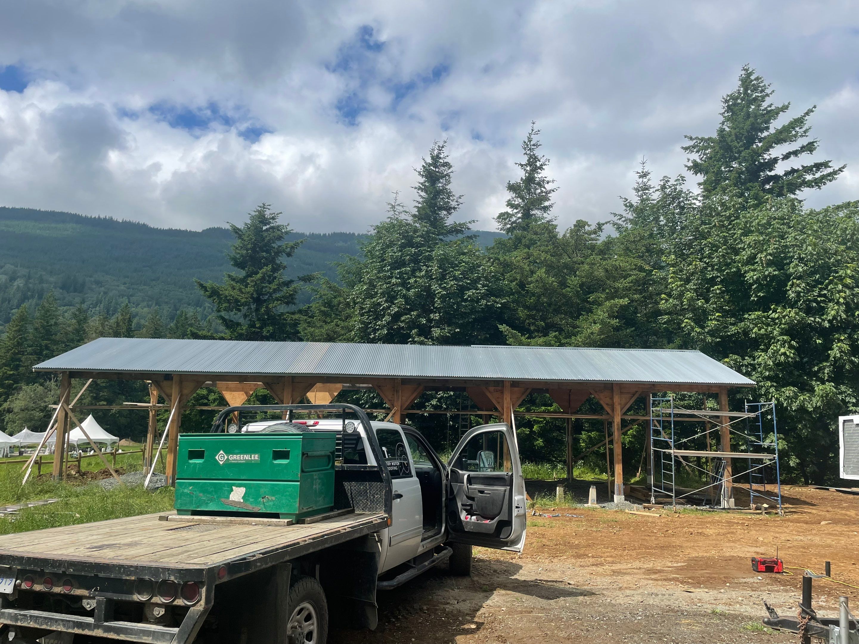 Commercial Roofing Installation using corrugated metal by Top Notch Roofing Inc