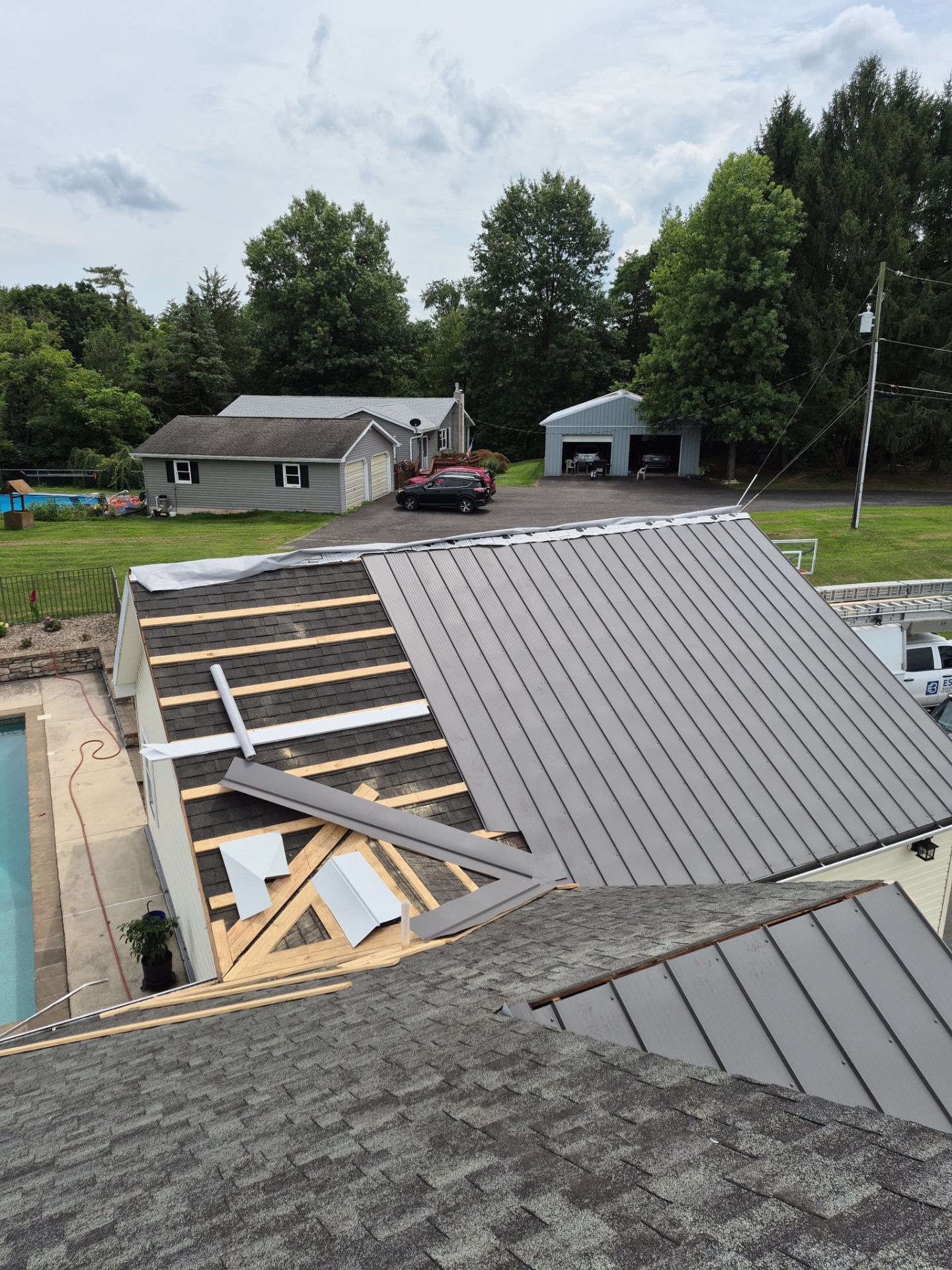 Newport Metal Roof Replacement with New Skylights by Esh Builders