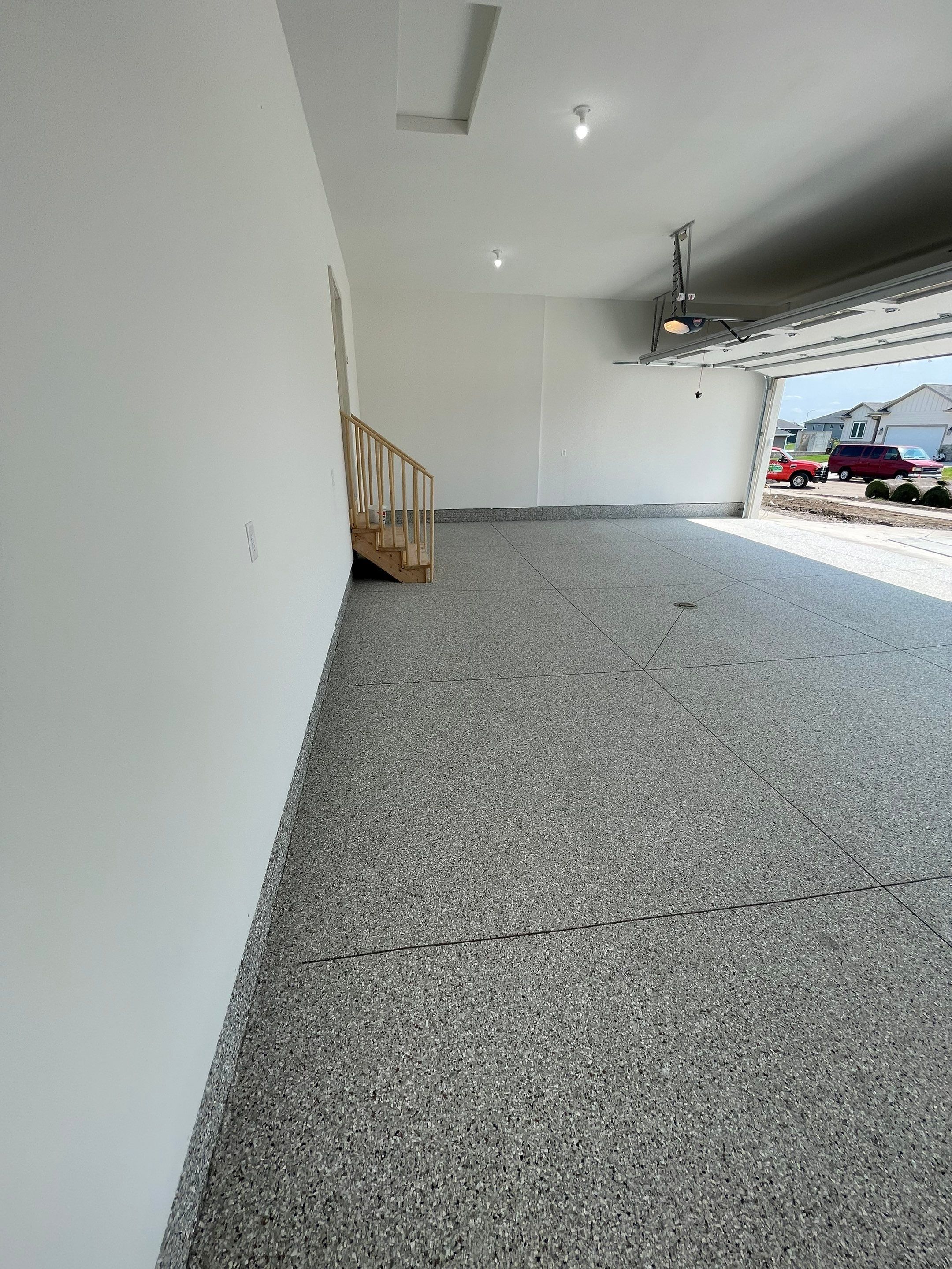 Grey Speckled Garage Floor Coating in Sioux Falls by Select Painting, Coatings & Garage Cabinets