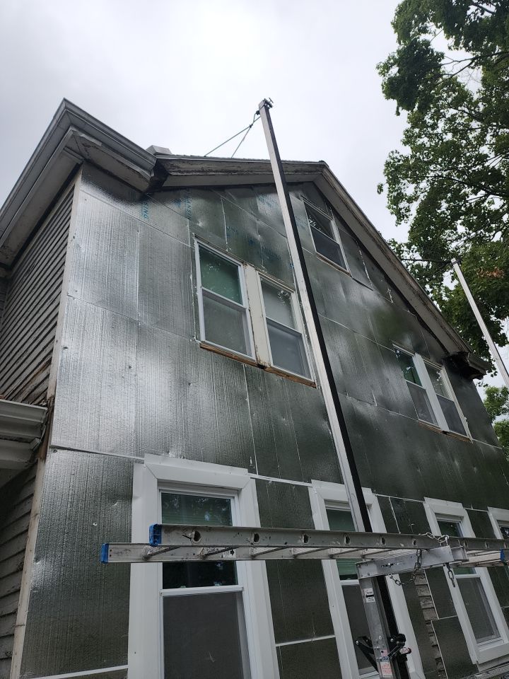 Vinyl siding layover project for 2 family in Wellesley, MA by UBrothers Construction