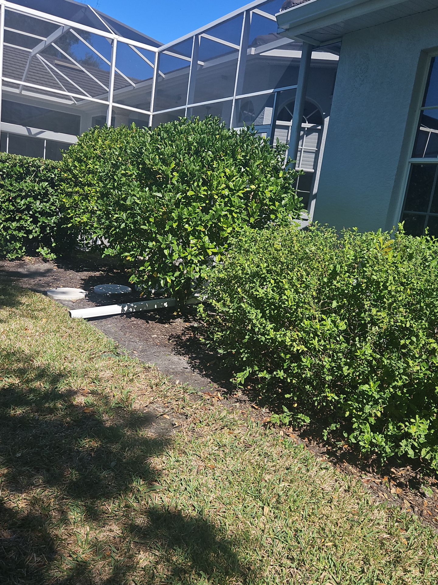 White Down Spouts using downspouts and White Seamless Gutters in Sarasota FL by Gutter Professors