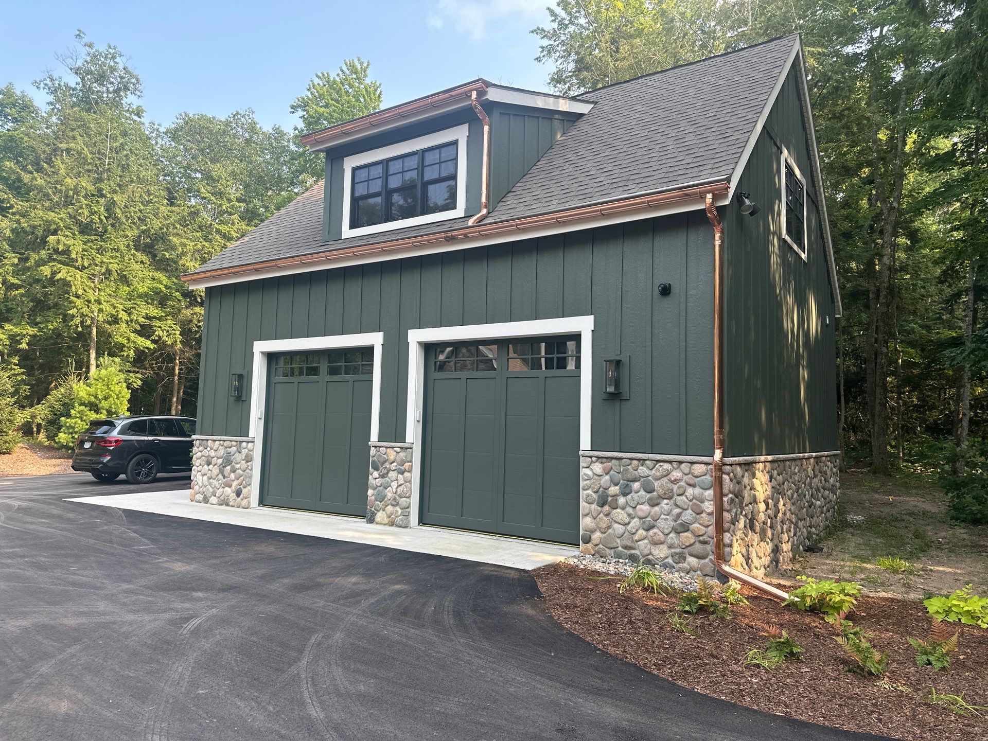 Copper Gutter and Downspout Installation for Omena Residence by Rainbow Seamless Systems