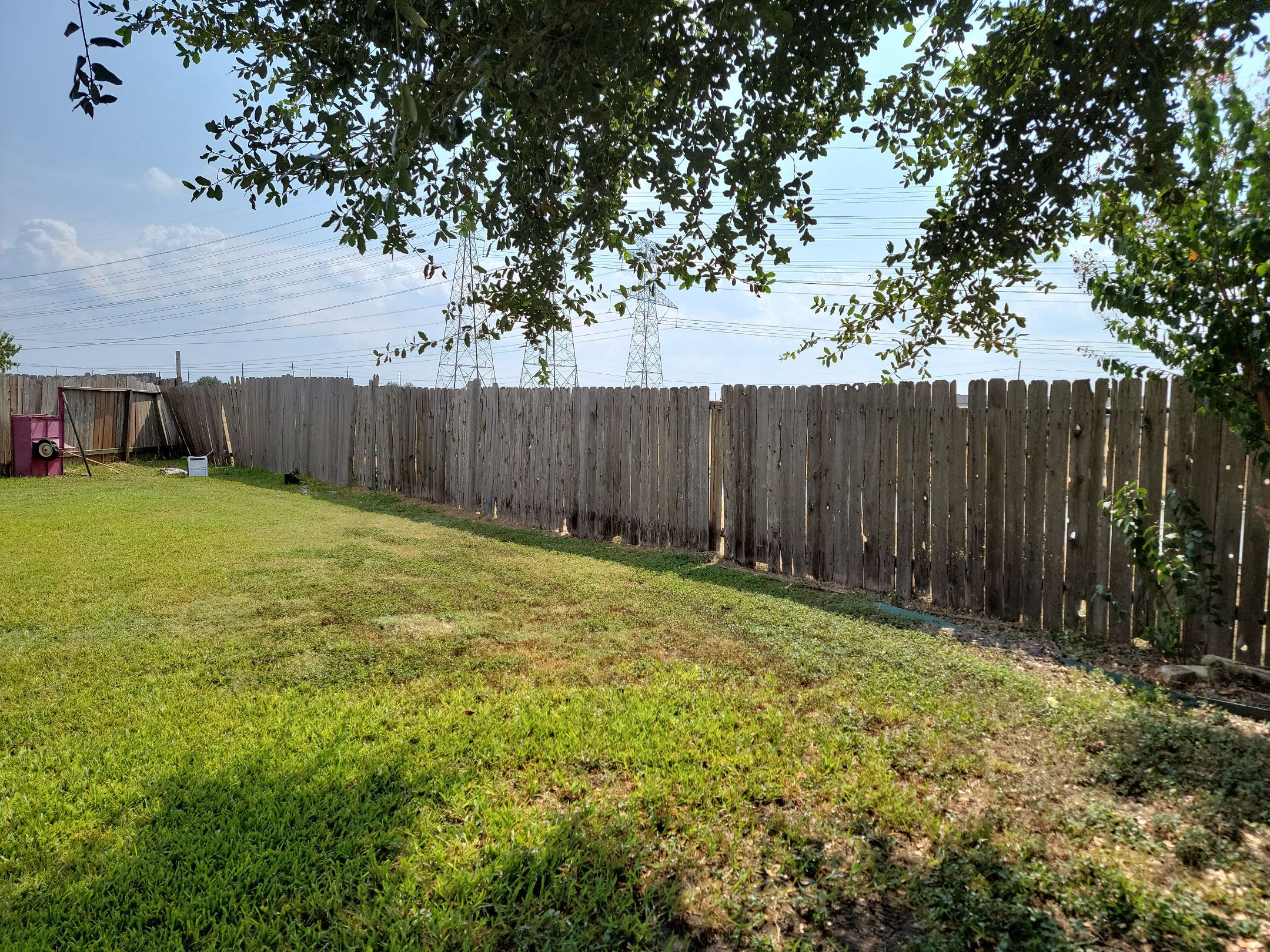 Beautiful Wood fence with metal posts by Tim's Fences