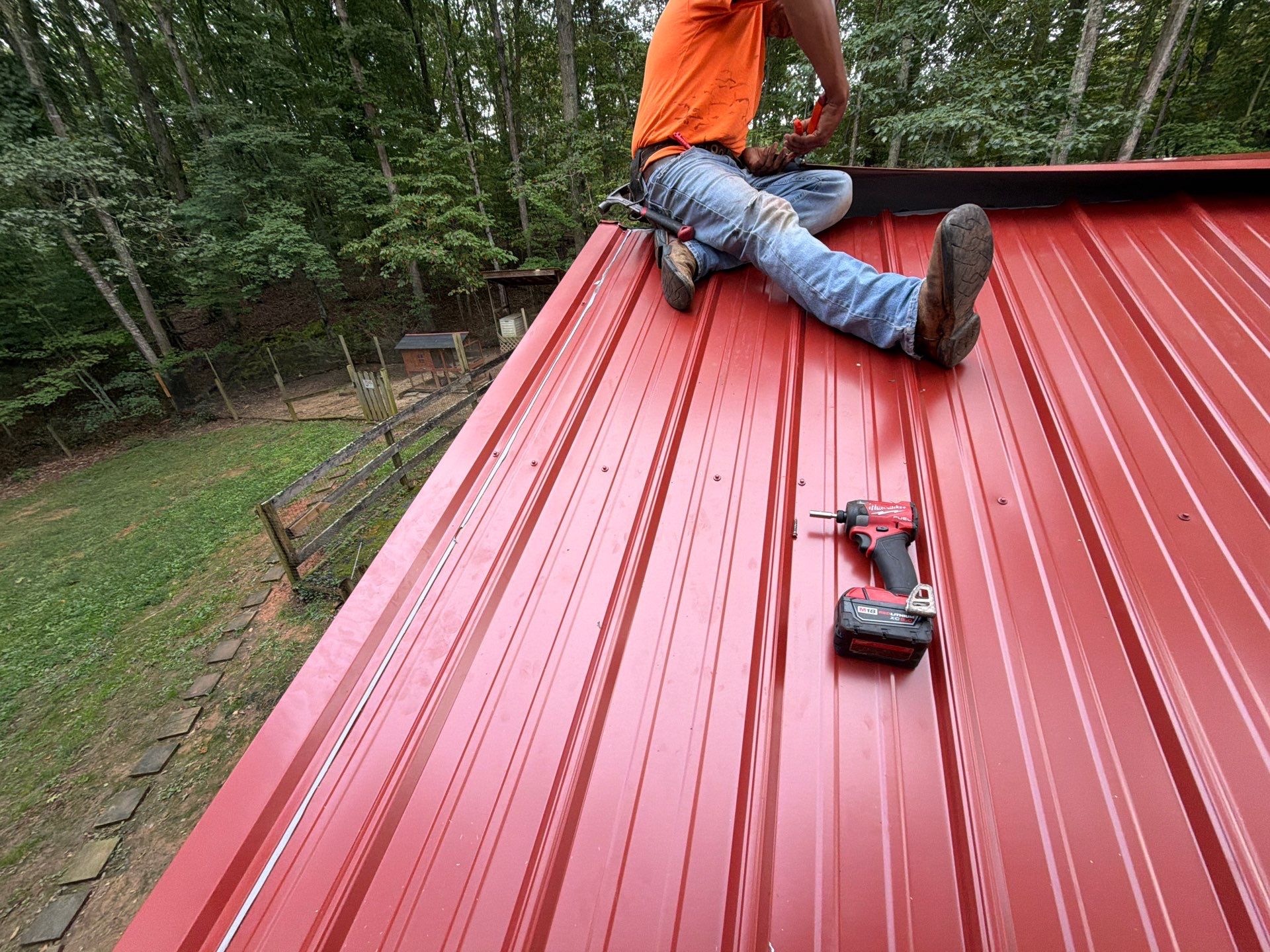 Red Metal Roof Restoration and Wood Fascia Replacement in Barboursville by Cade Construction