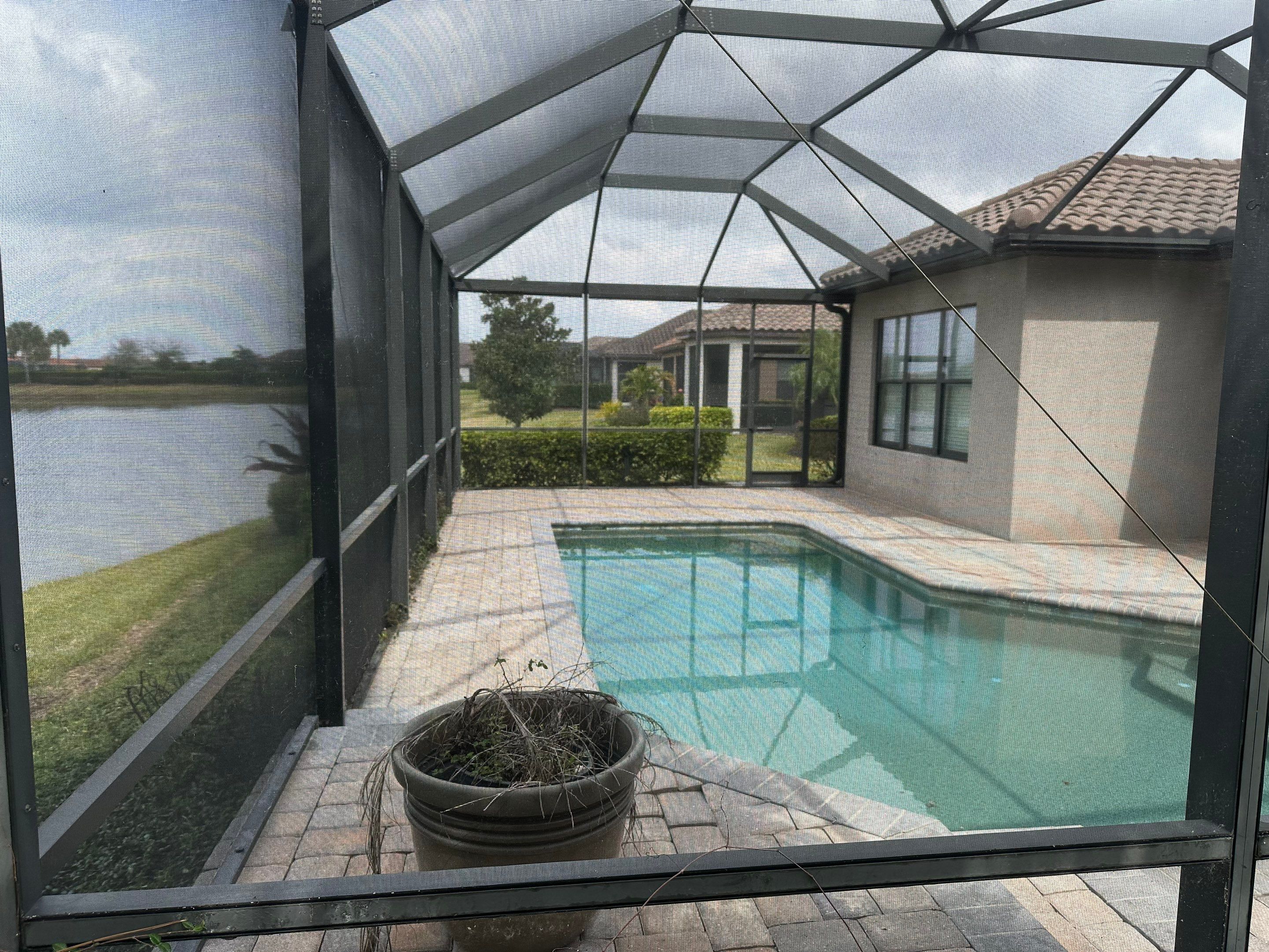 Concrete Tile Roof, Paver Pool Deck, Screen Enclosure & Driveway Cleaning in Artisan Lakes Esplanade, Palmetto, FL | Sunshine AquaWash by Sunshine AquaWash