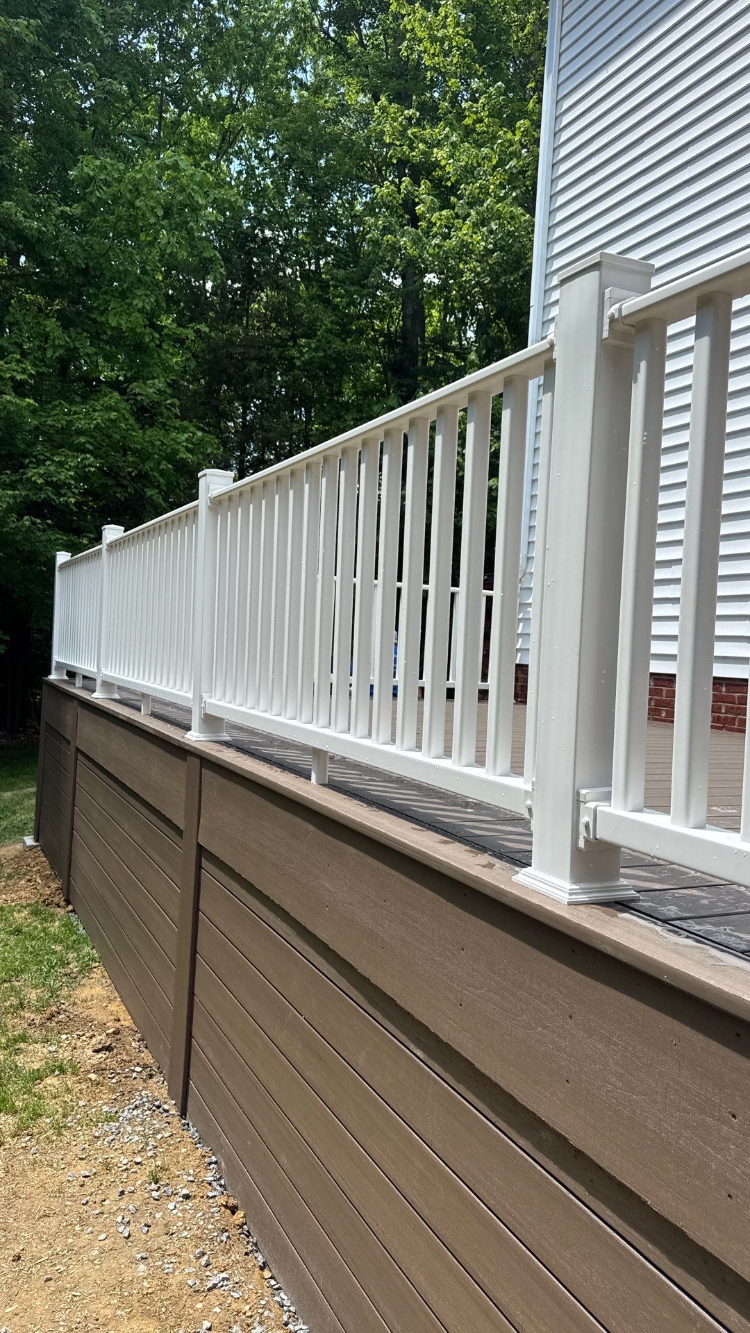 Custom Composite Deck and White Vinyl Railing Installation in Fayetteville by Walnut Hollow Decks & Outdoor Living