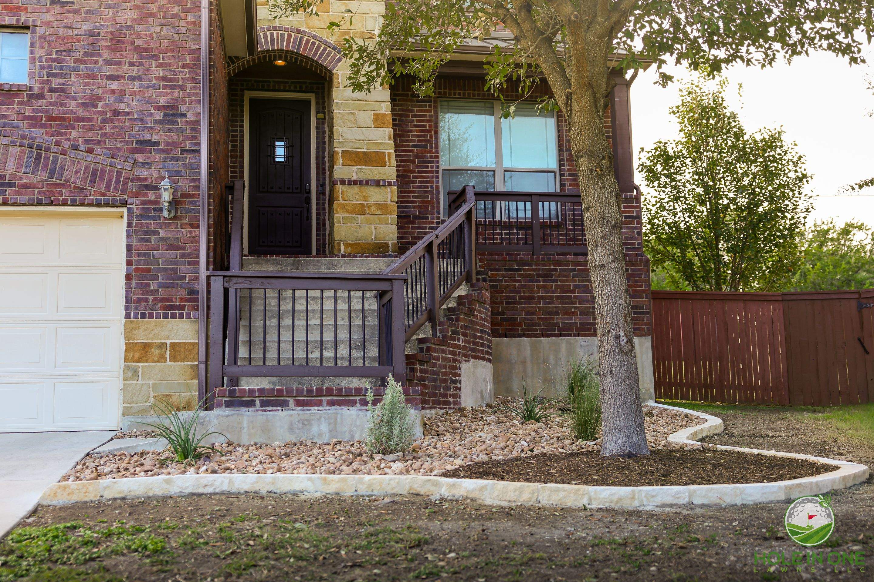 Low-Maintenance Front Yard Xeriscape with Chopstone Border, North San Antonio TX by Hole In One Lawns, LLC