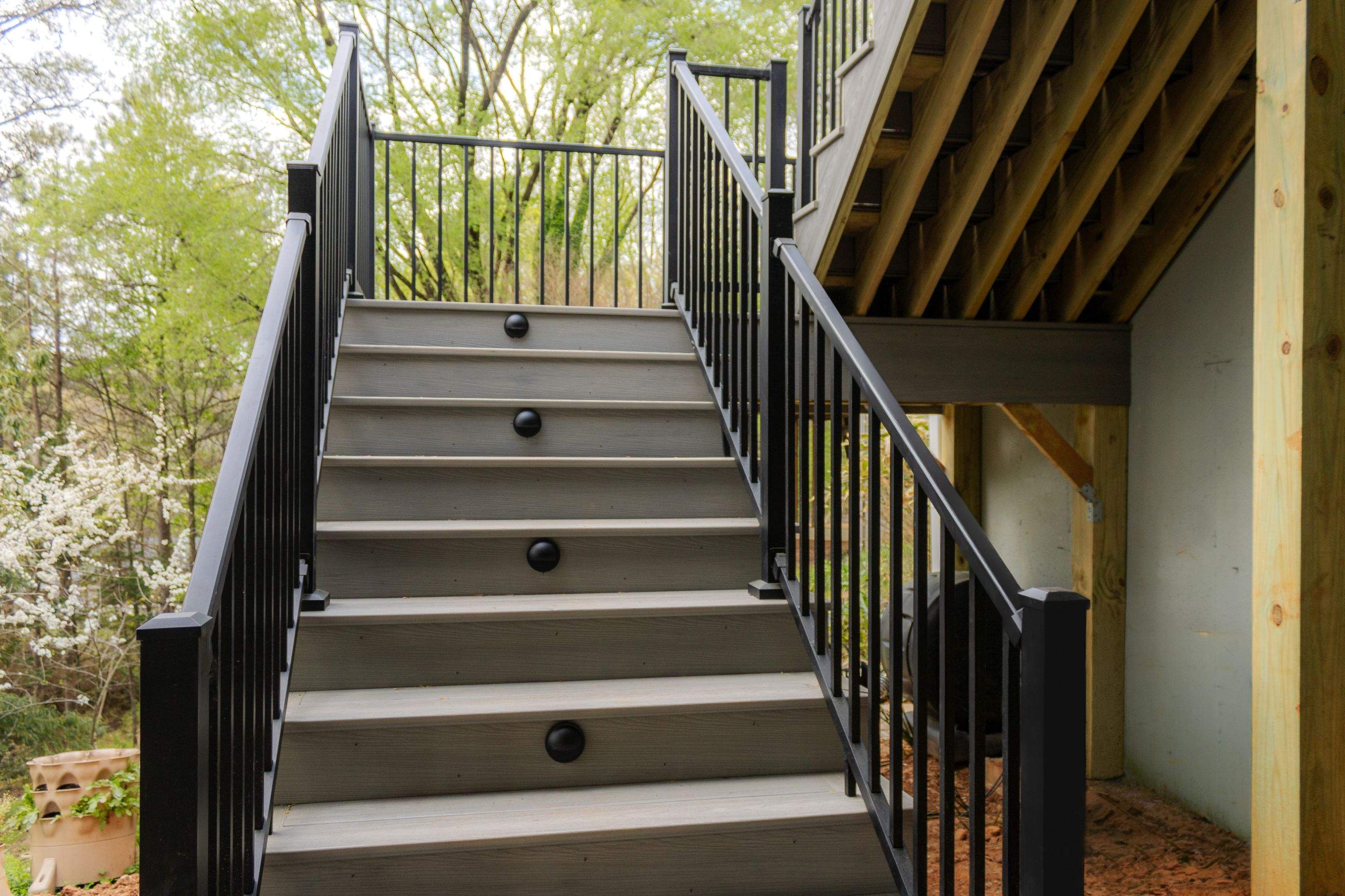 Covered Porch and Deck Build using Deckorators Venture Series Decking and Trex Select Aluminum Railing by Nelson Exteriors