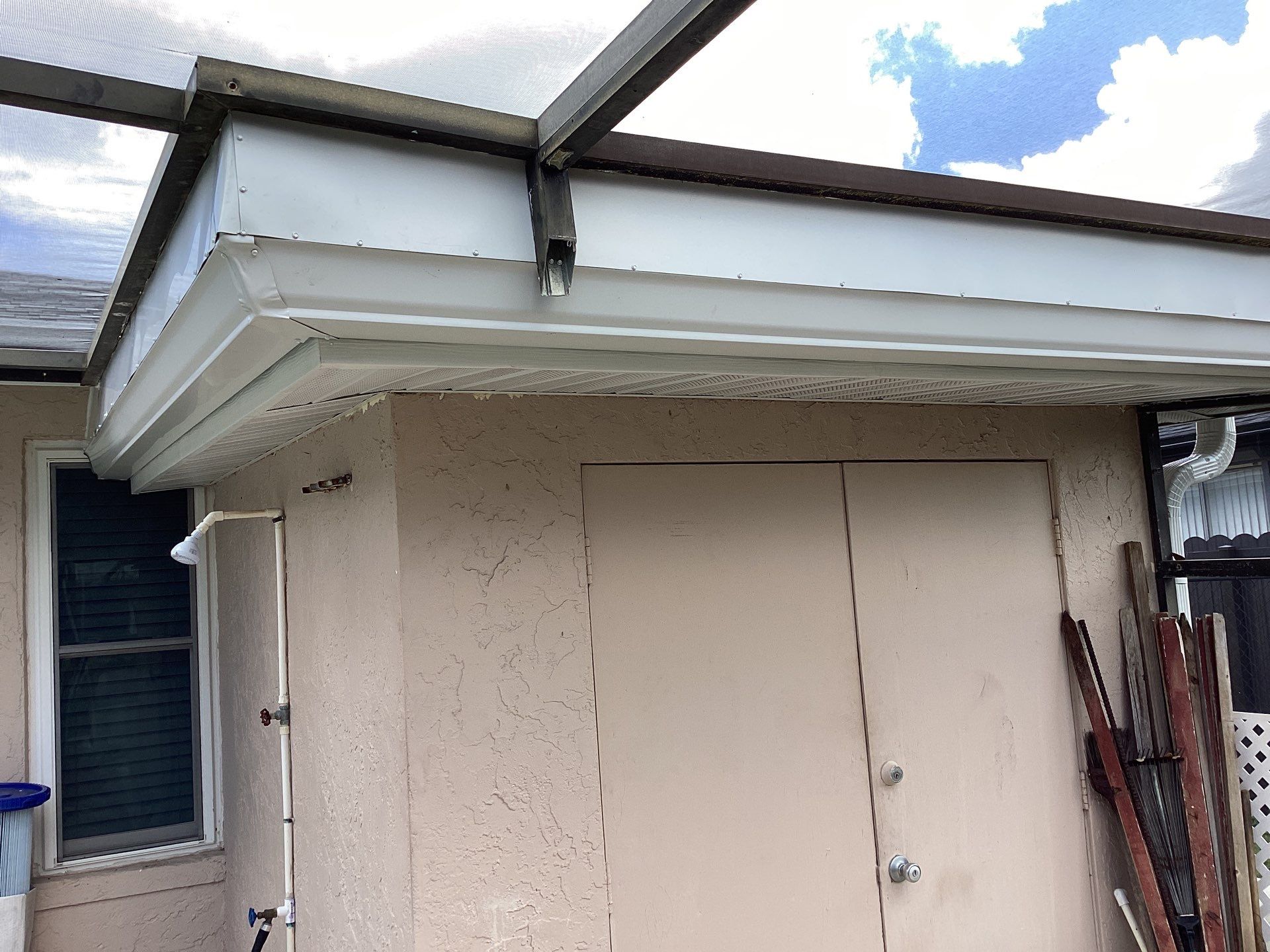 White Seamless Gutters and Splash Guards in Fort Myers FL by Gutter Professor by Gutter Professors