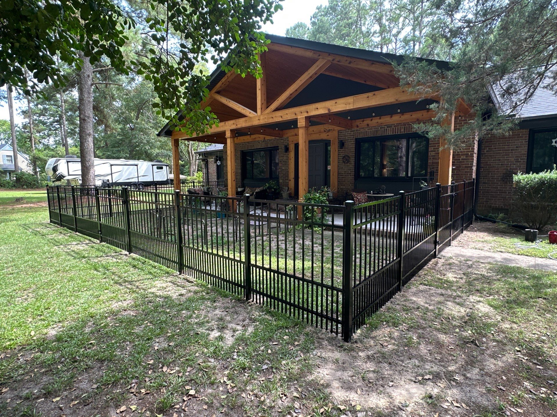 Black Vinyl Privacy Fence with Puppy Picket Aluminum Installation in Roseboro by Superior Fence and Rail