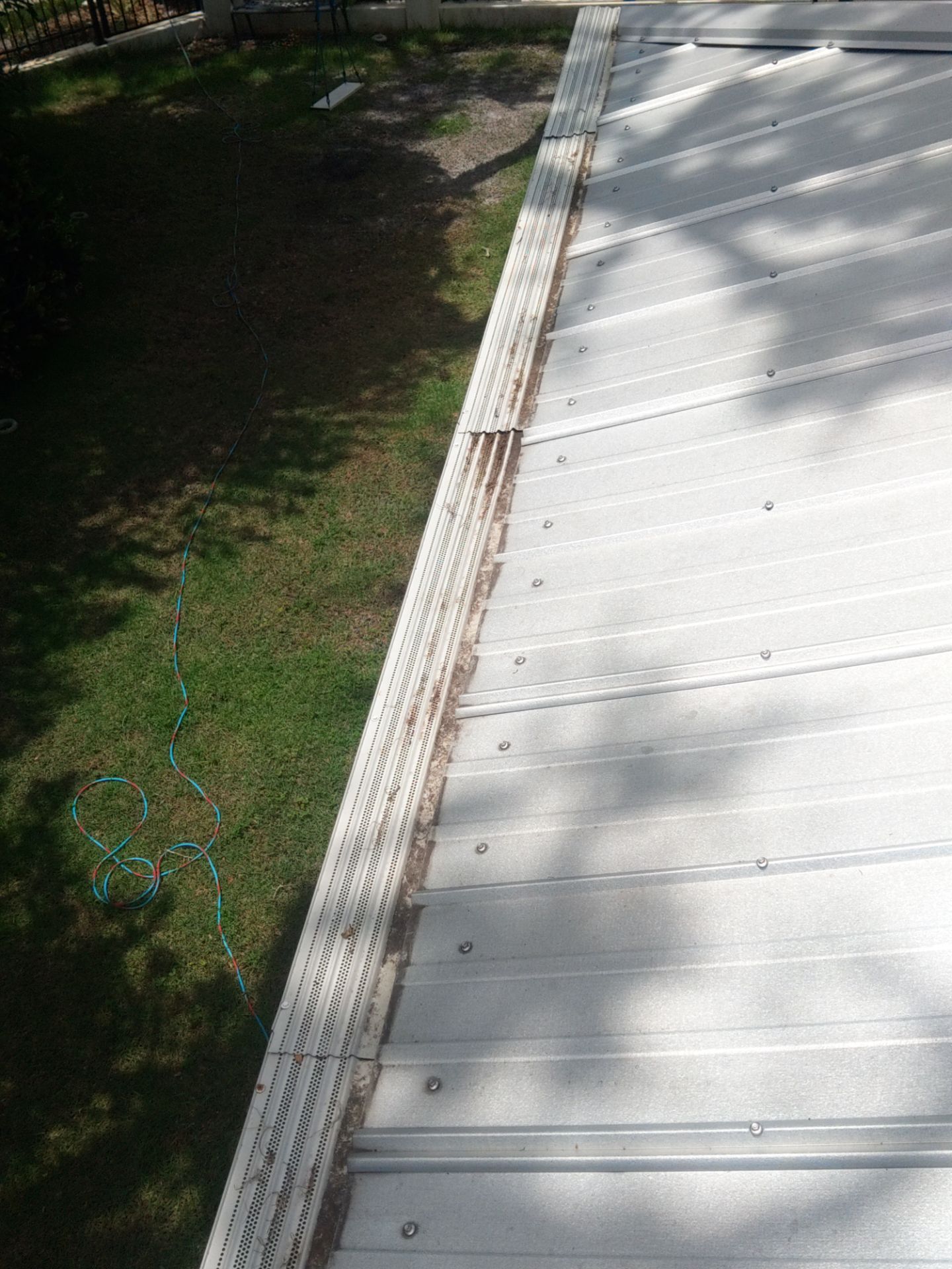 Gutter guards installation combined with gutter cleaning in Sarasota, FL by Gutter Professors