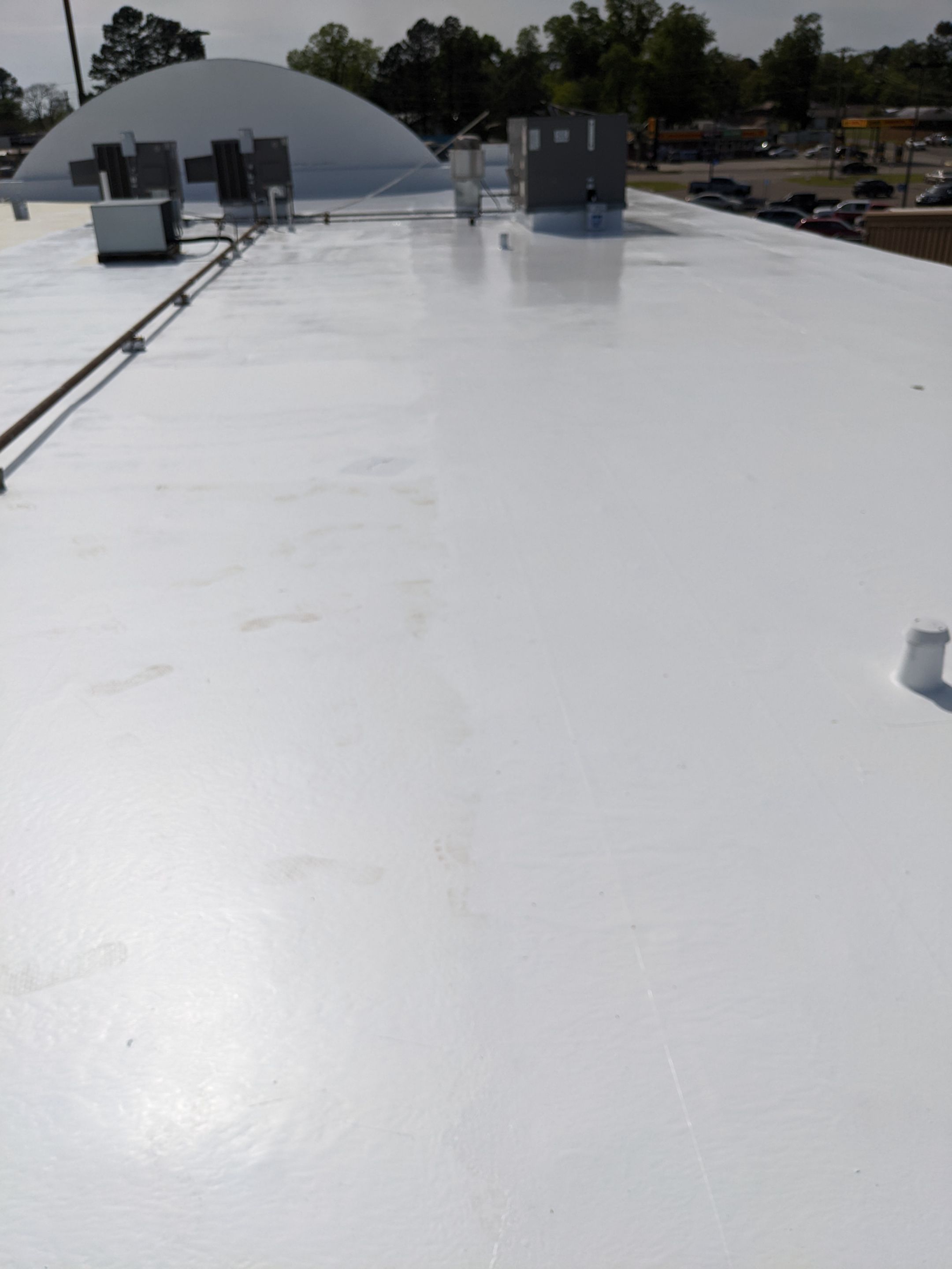 Commercial Roofing Installation using Aldocoat Coatings by Hostetler Roofing
