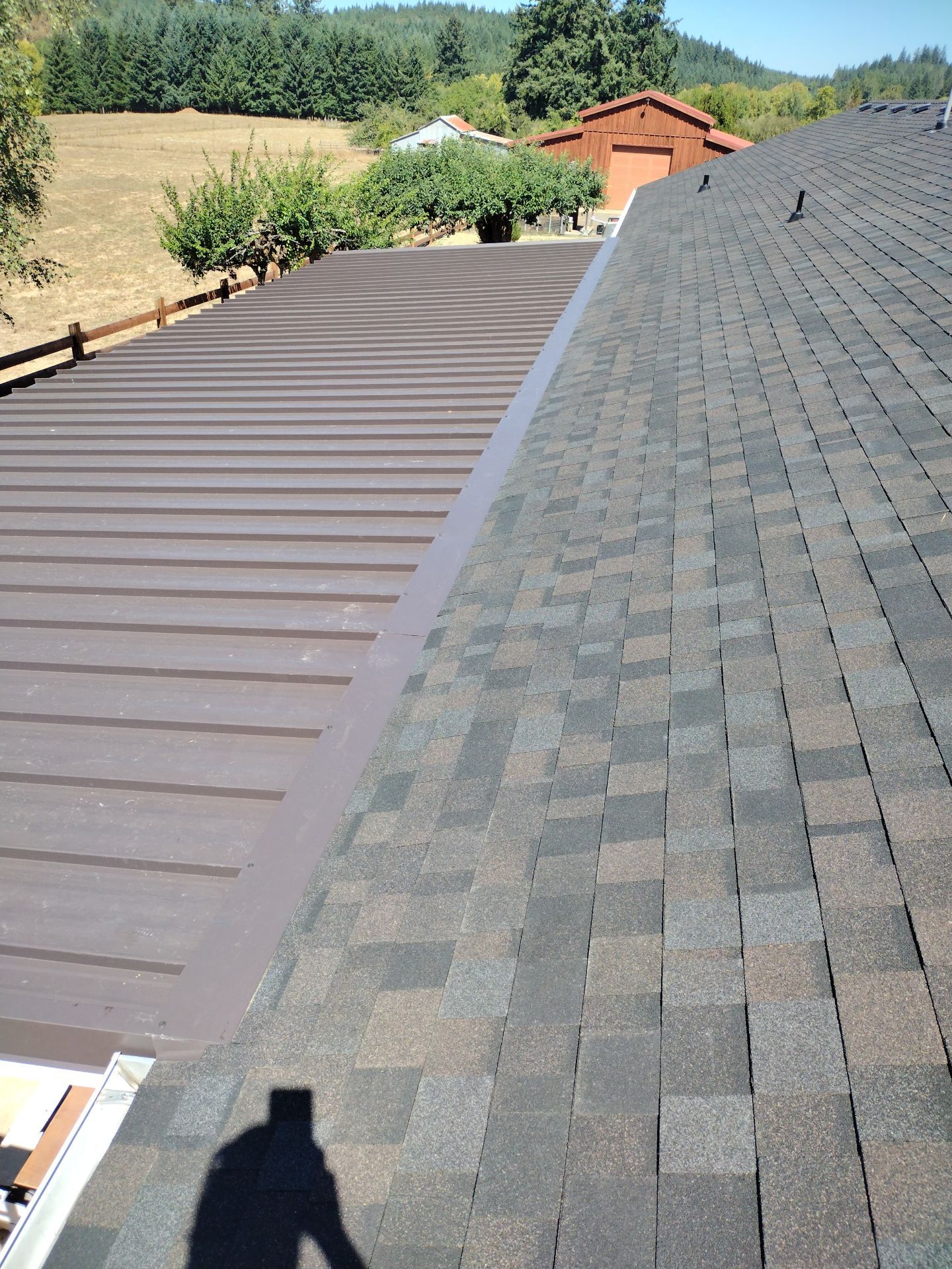 Residential Roof Replacement with Metal Accents by Orezona Building & Roofing Company, Inc.