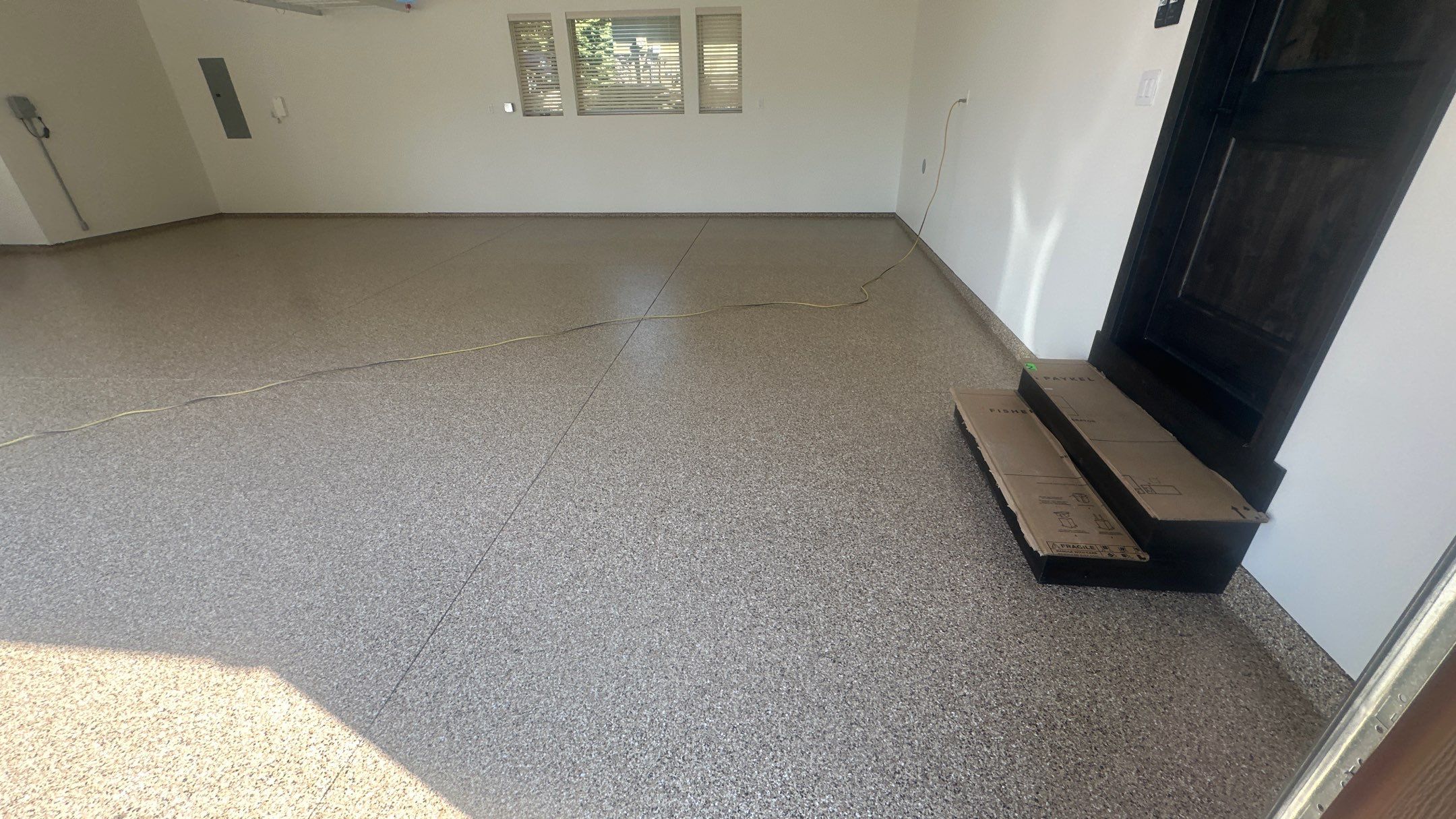 Garage Transformation using Sandstone by Croc Coatings, LLC
