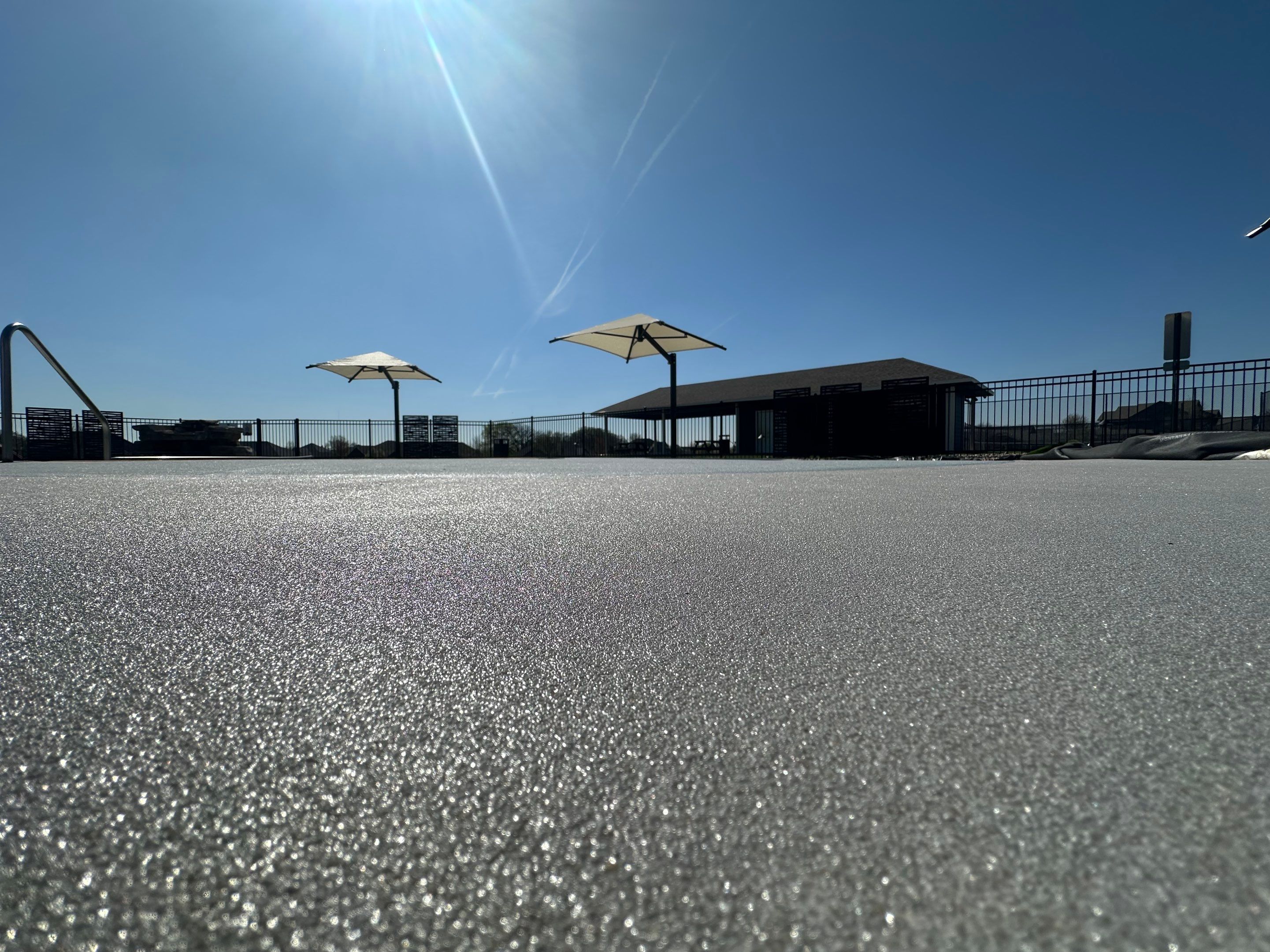 Arbors Edge Pool Deck Restoration and Textured Concrete Coating by Select Painting, Coatings & Garage Cabinets