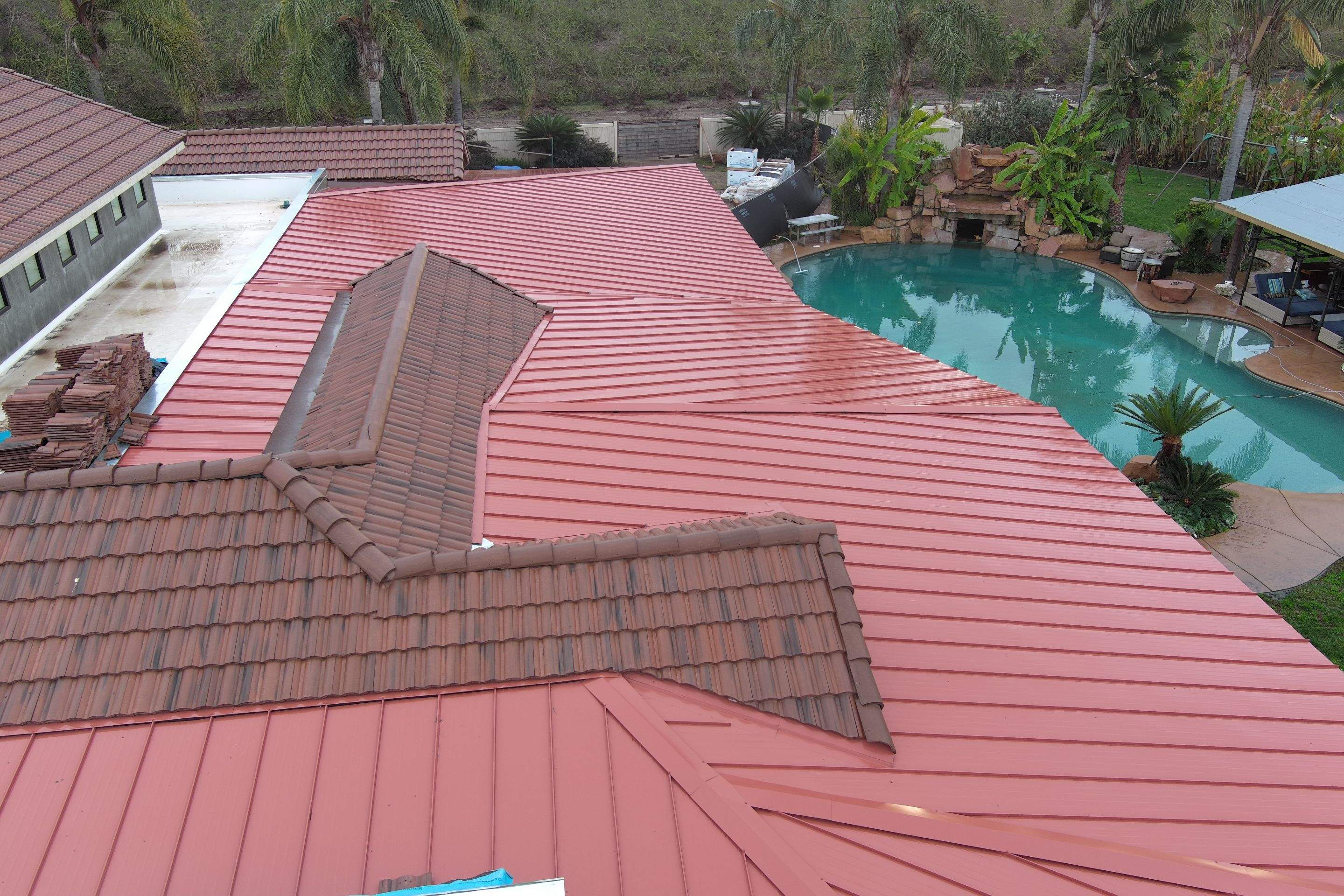 Tile, Metal, and TPO roofing project (new construction) by Straight Edge Roofing Inc