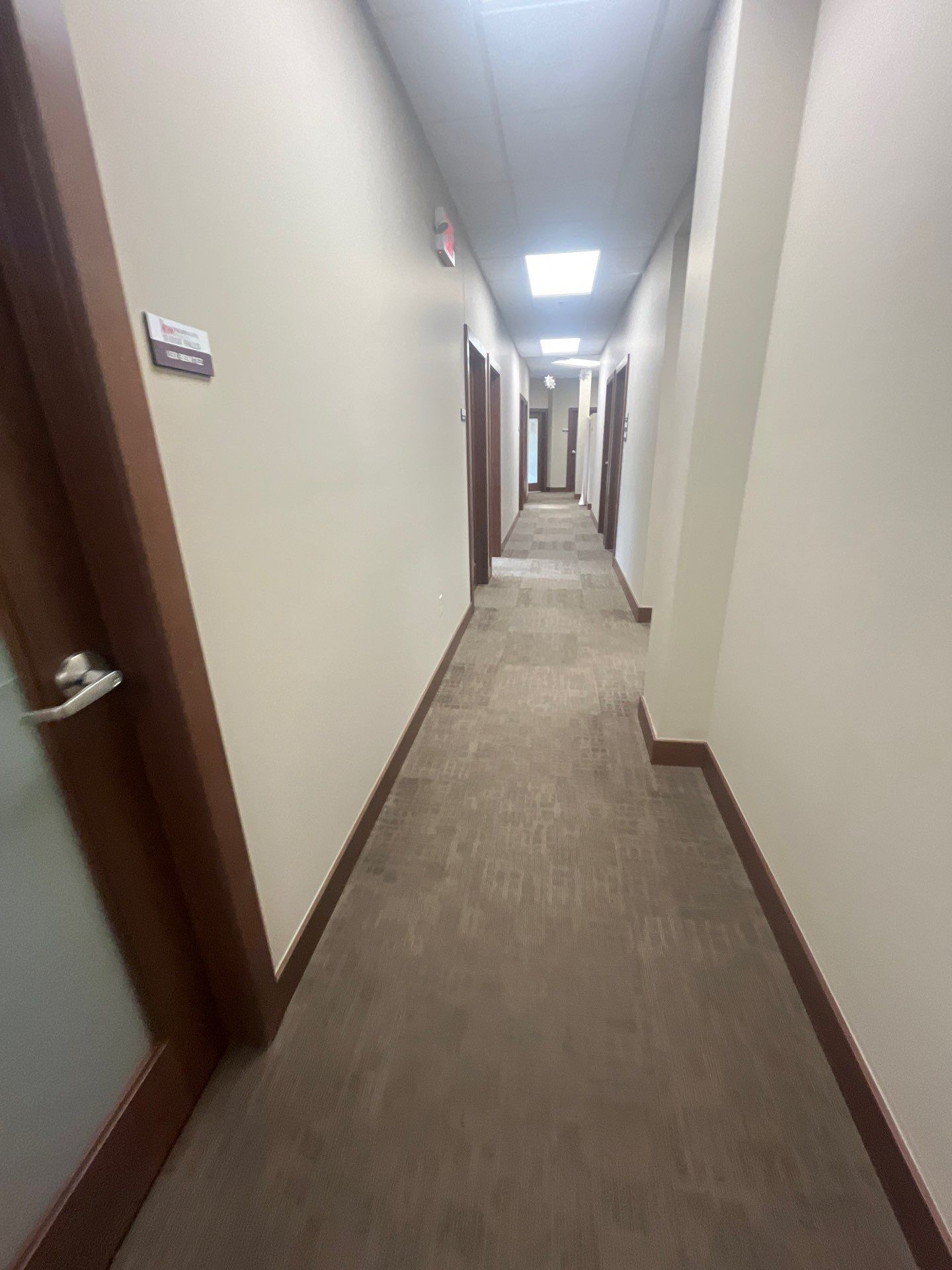 Commercial Office Interior Remodel and Modern Suite Refresh in Sioux Falls by Select Painting, Coatings & Garage Cabinets