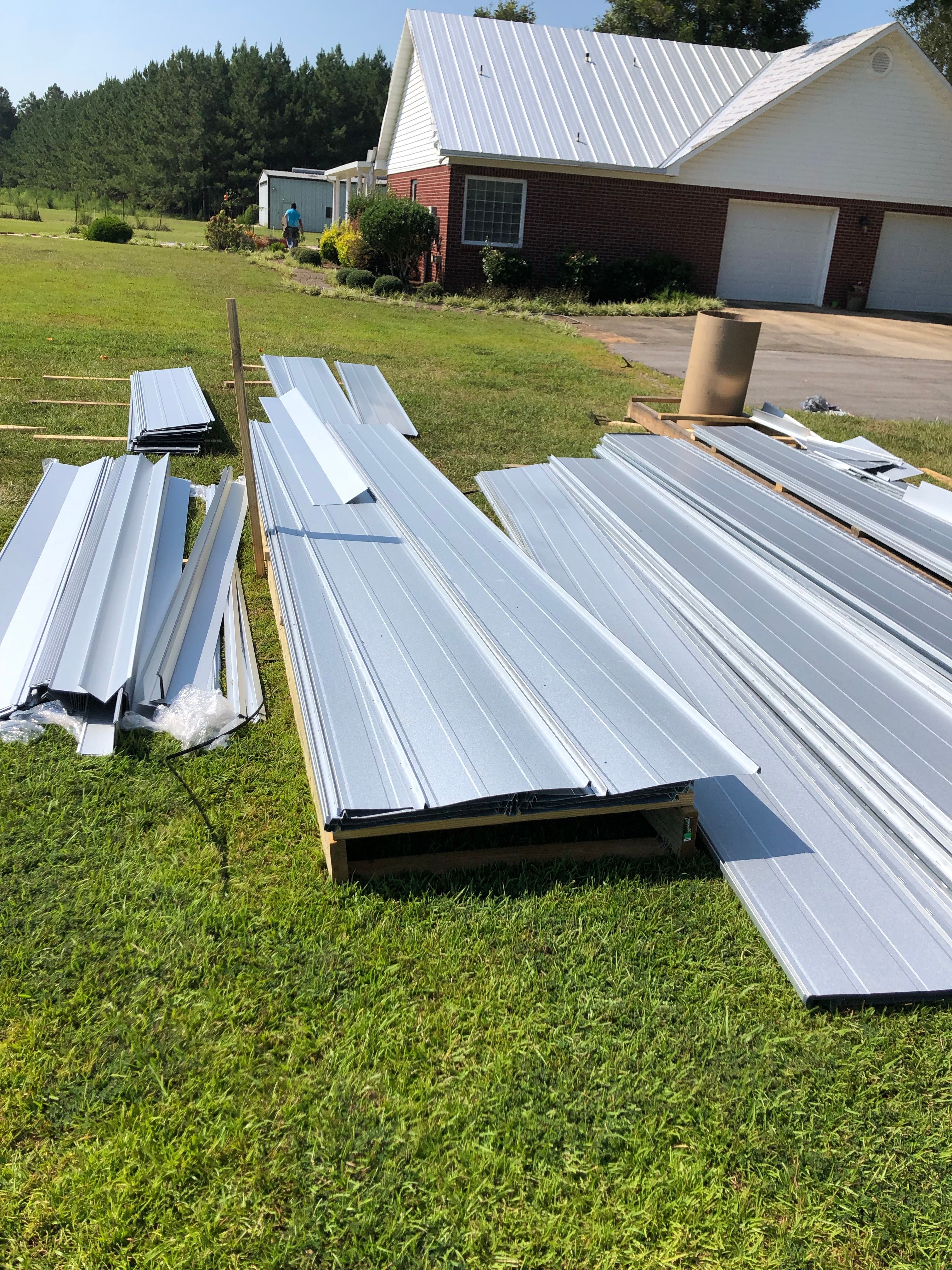 Residential Roofing Installation using Metal roofing by American Roofing & Construction LLC