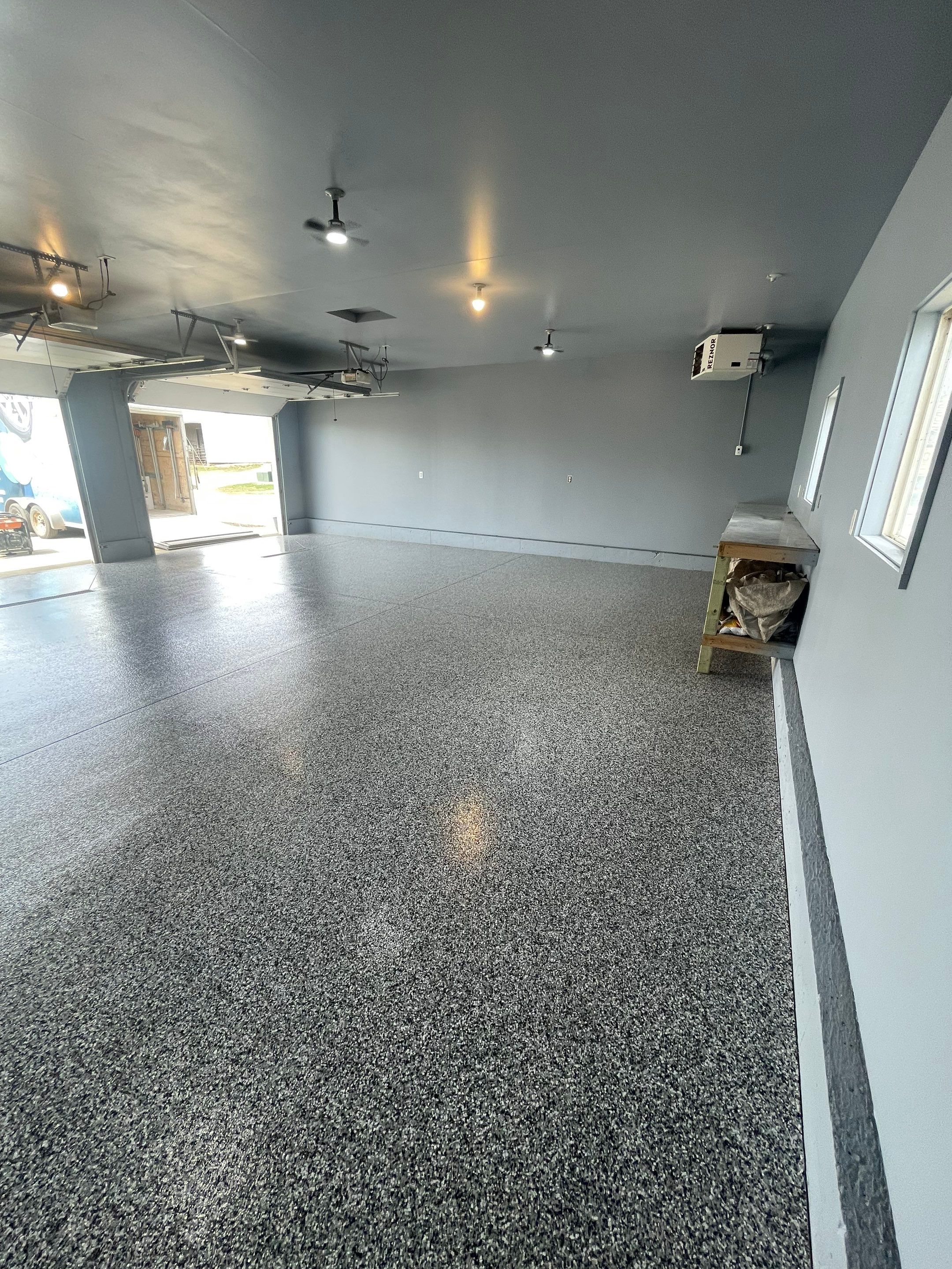 Grey Granite-Style Garage Floor Coating and Stairs in Hartford by Select Painting, Coatings & Garage Cabinets