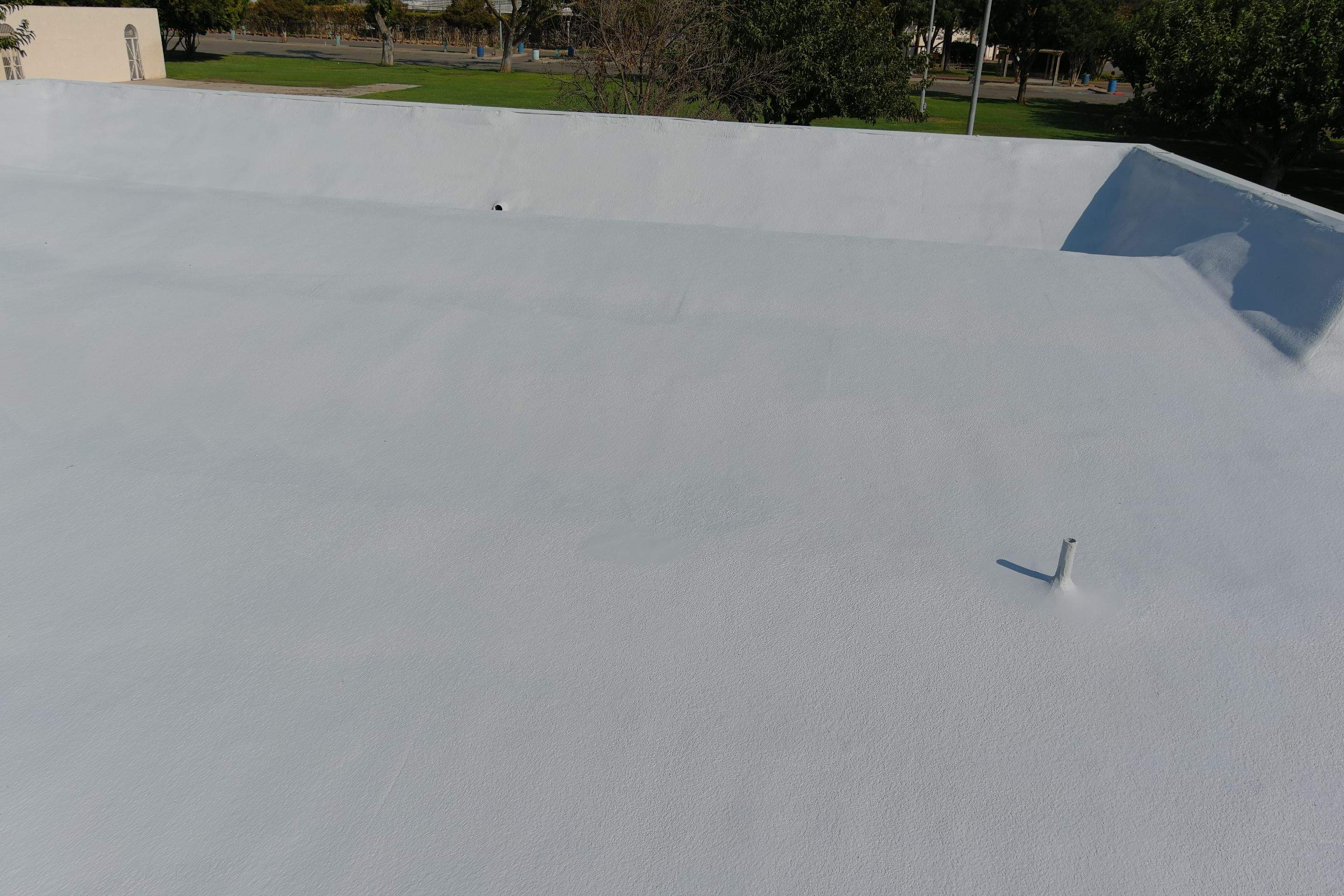 Commercial Roofing Installation using General Coatings acrylic coatings and spray foam by Straight Edge Roofing Inc