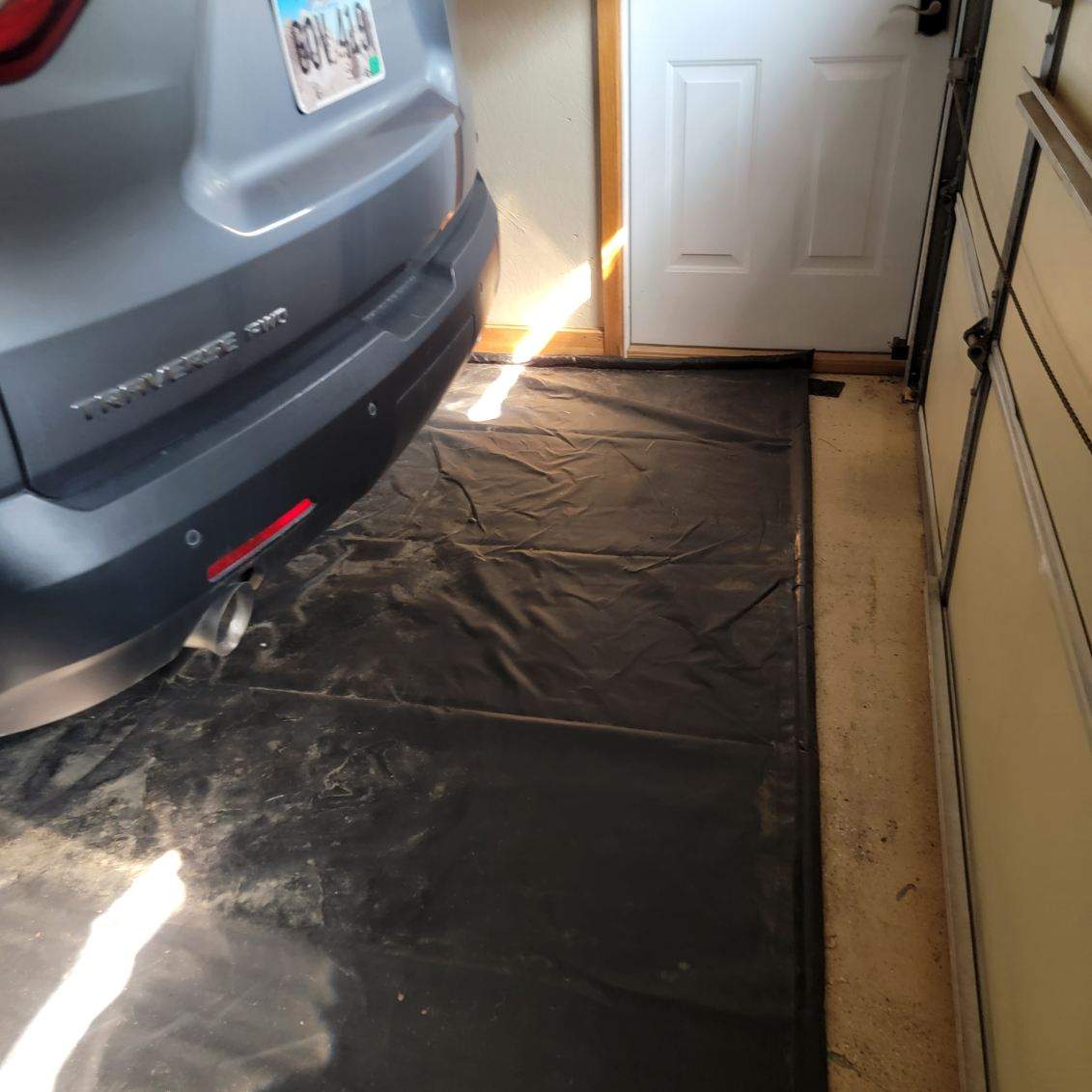 Full Garage and Basement Epoxy Floor Coating in Winner by Select Painting, Coatings & Garage Cabinets