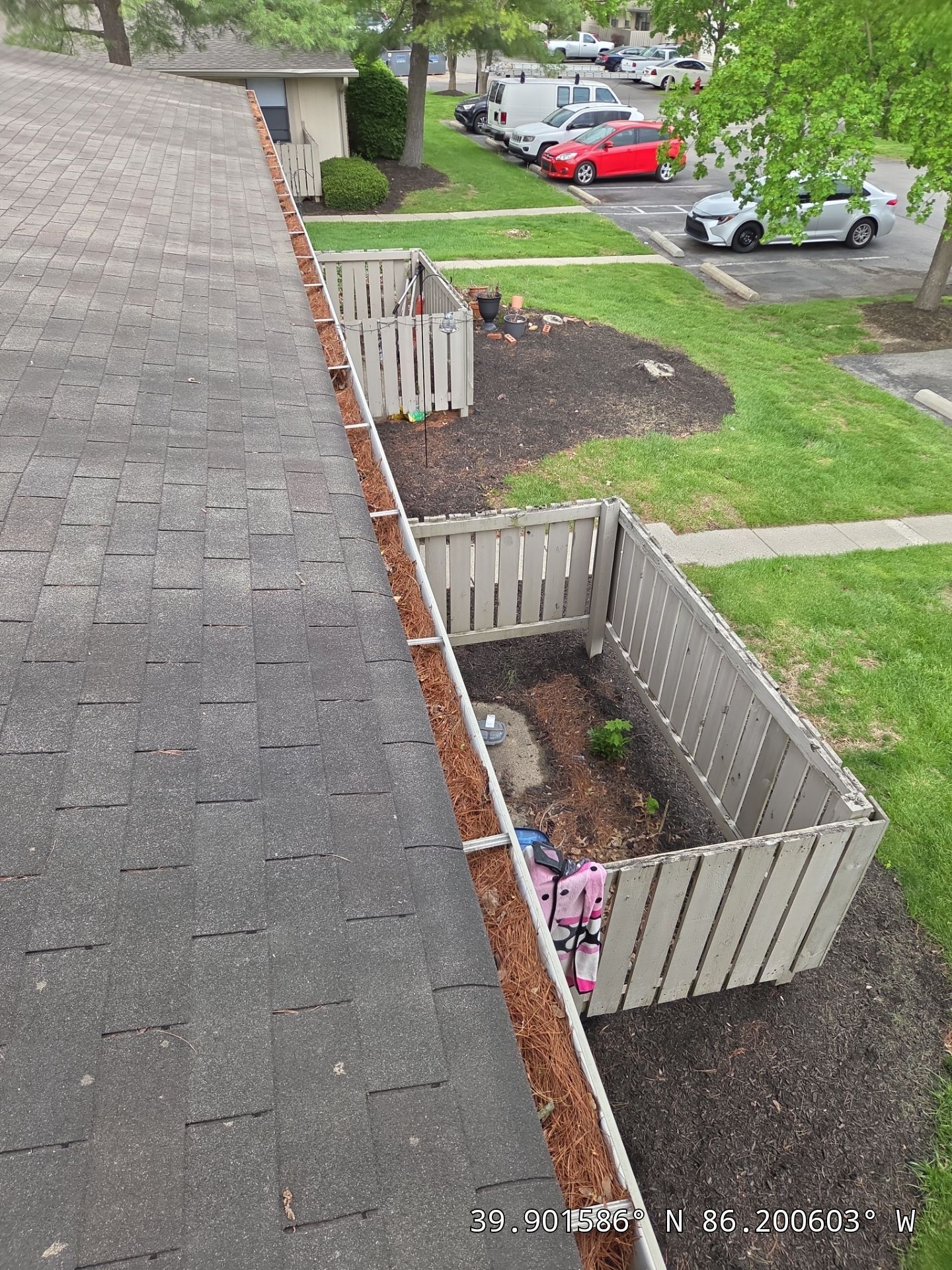 Commercial gutter cleaning Indianapolis before photo with filled gutters