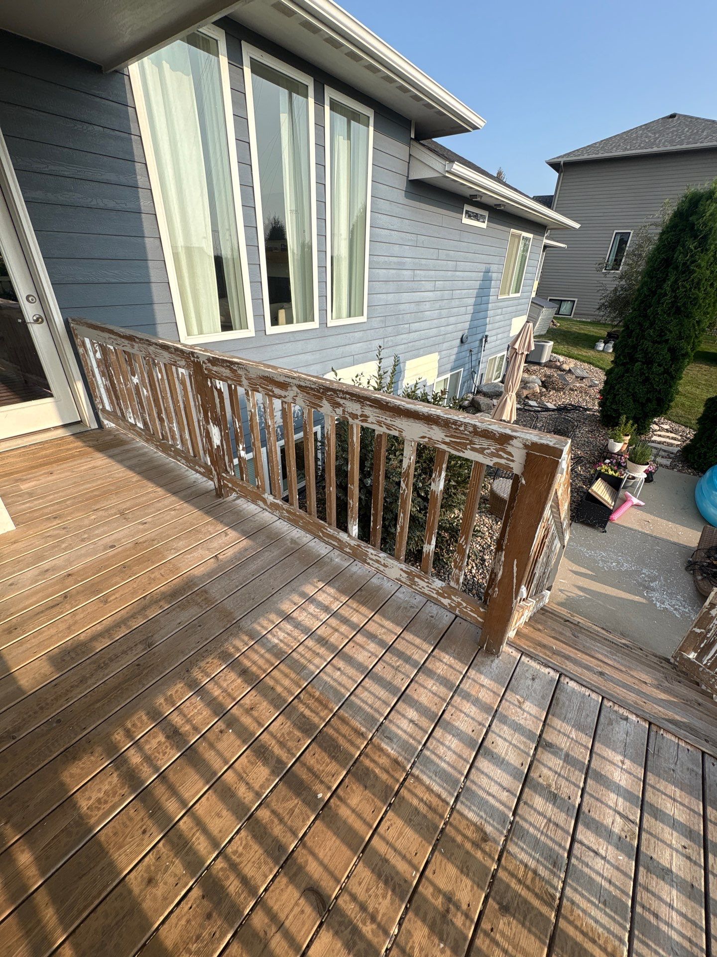 Sioux Falls Exterior Residential Siding and Deck Painting Project by Select Painting, Coatings & Garage Cabinets