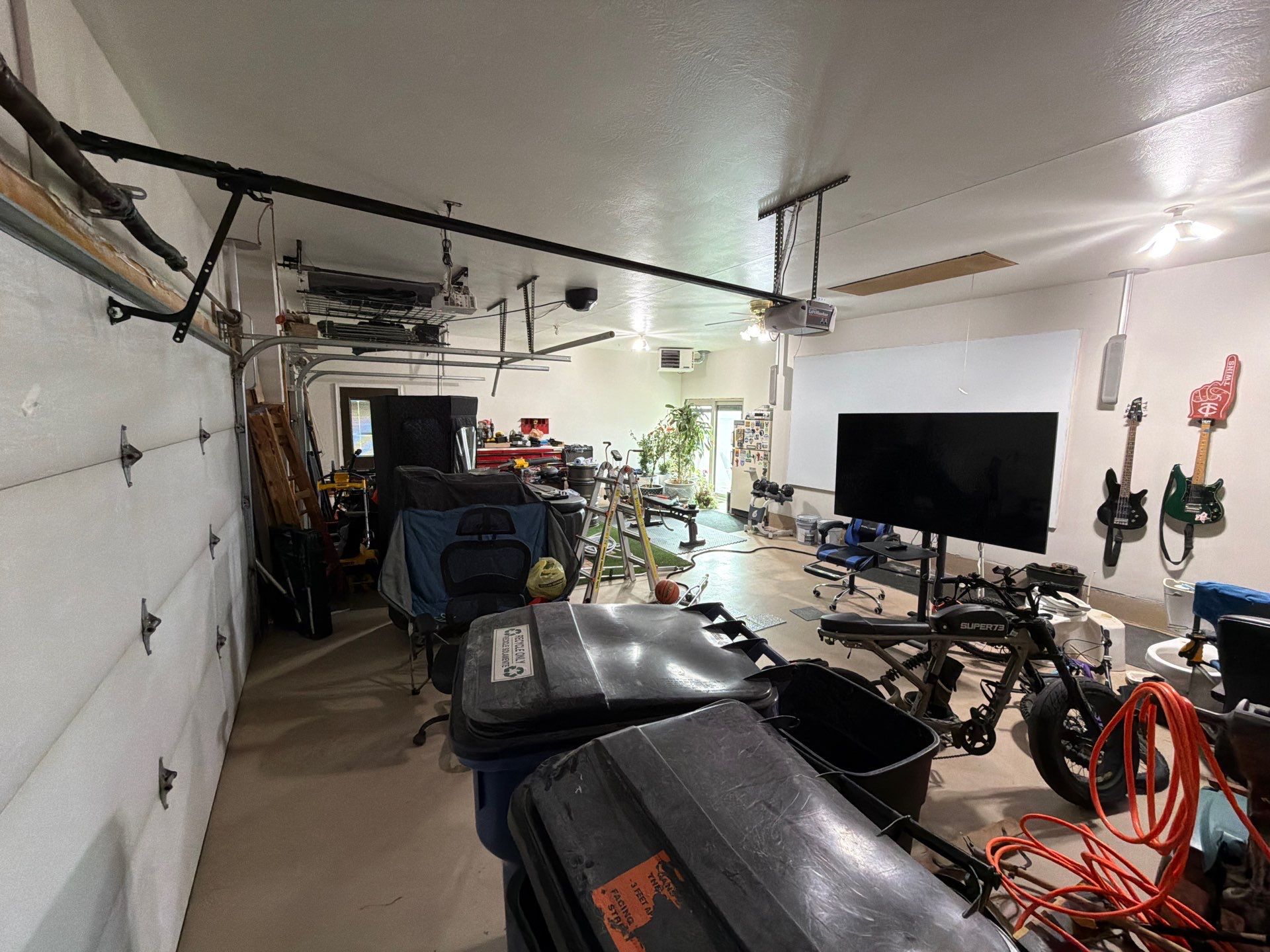 Residential Garage Floor Coating with Grey Speckled Epoxy Finish by Select Painting, Coatings & Garage Cabinets