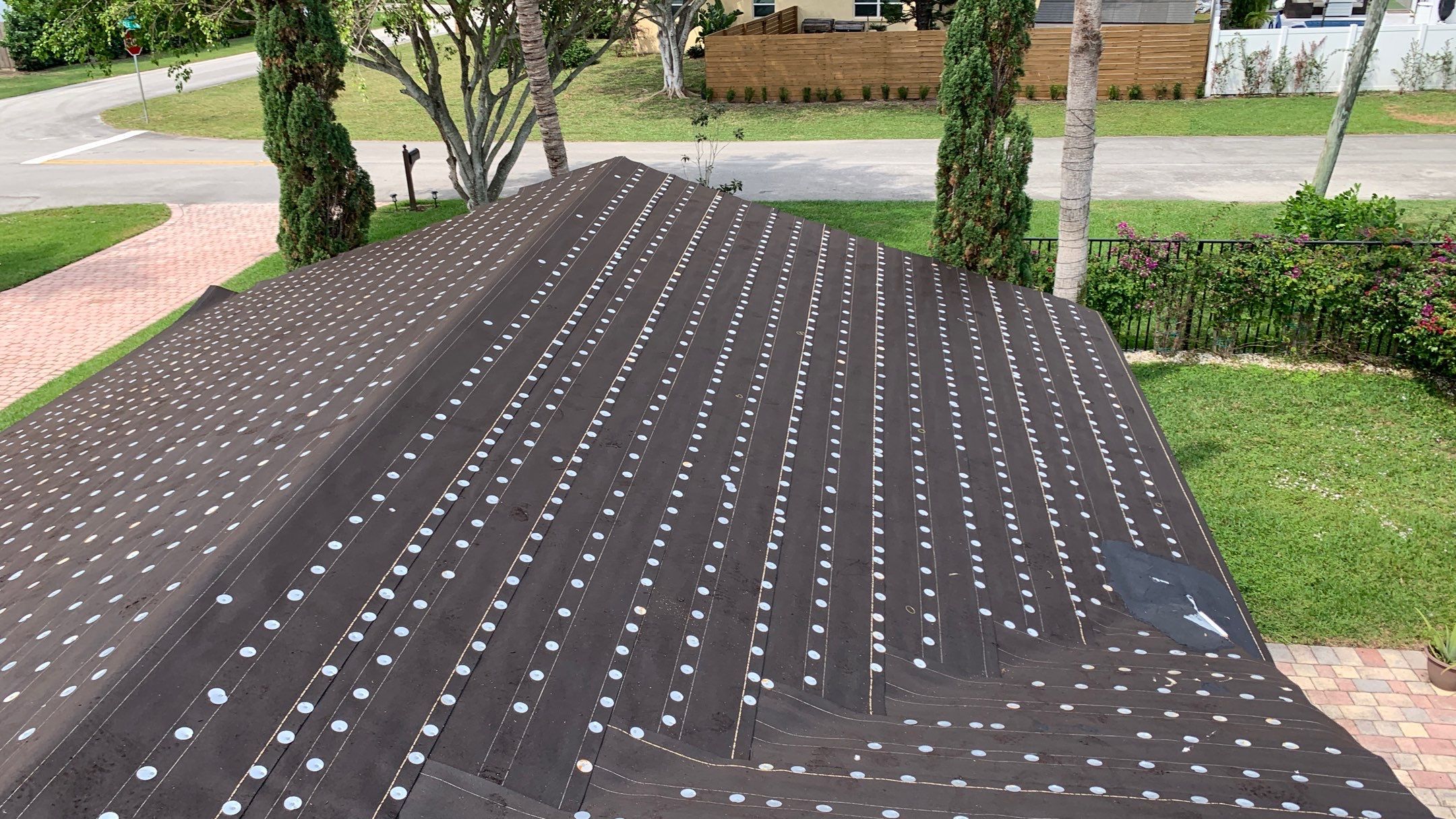 Residential Roofing Installation using 1" Nail strip metal roof by BLUES BROTHERS ROOFING