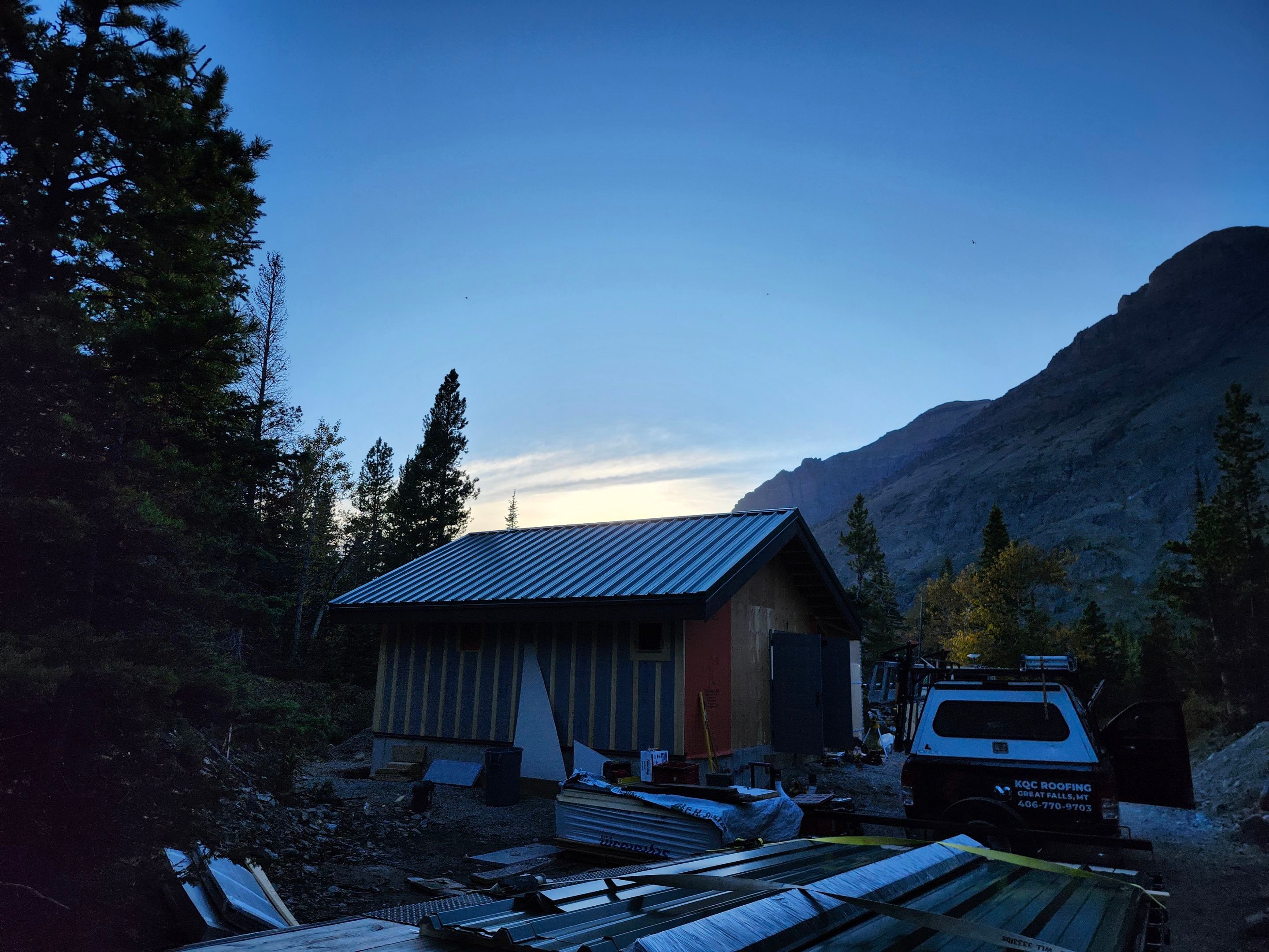 Green Standing Seam Metal Roof Installation in East Glacier Park by KQC Roofing