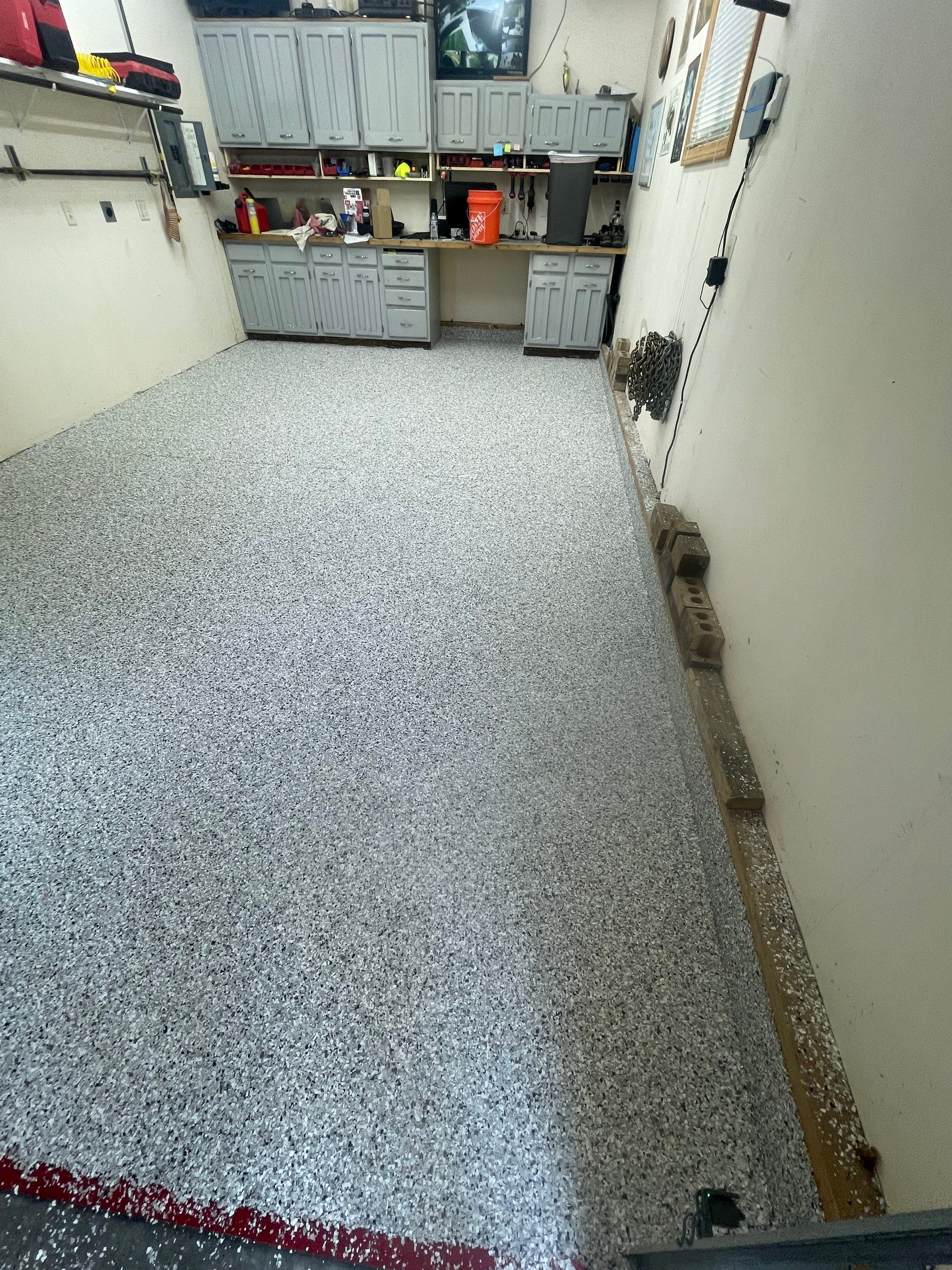 Multi-Stall Garage Floor Coating Installation in Sioux Falls by Select Painting, Coatings & Garage Cabinets