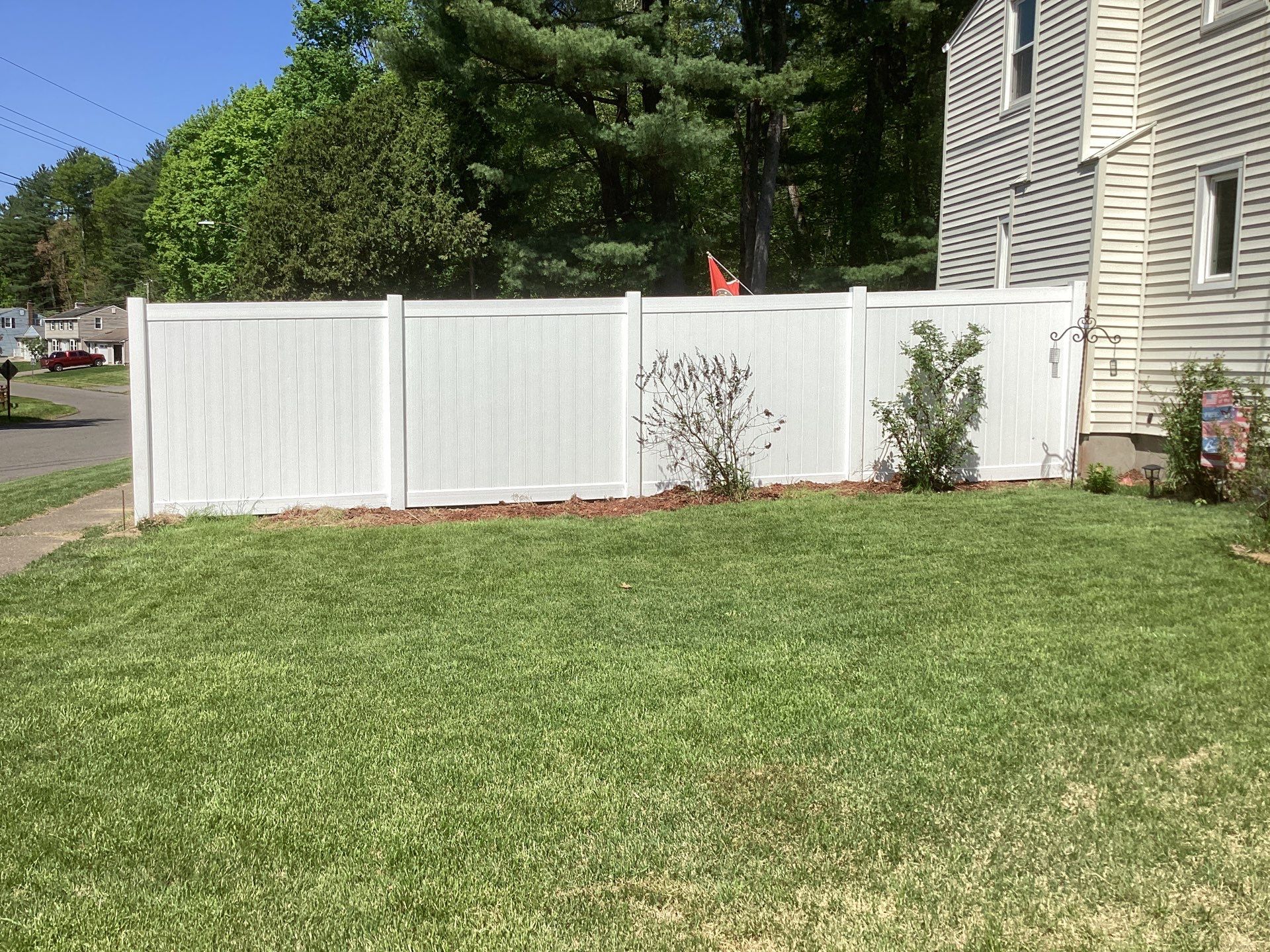 Replacement fence with White Vinyl Privacy and matching gates.  by DiGiorgi Roofing and Siding Inc