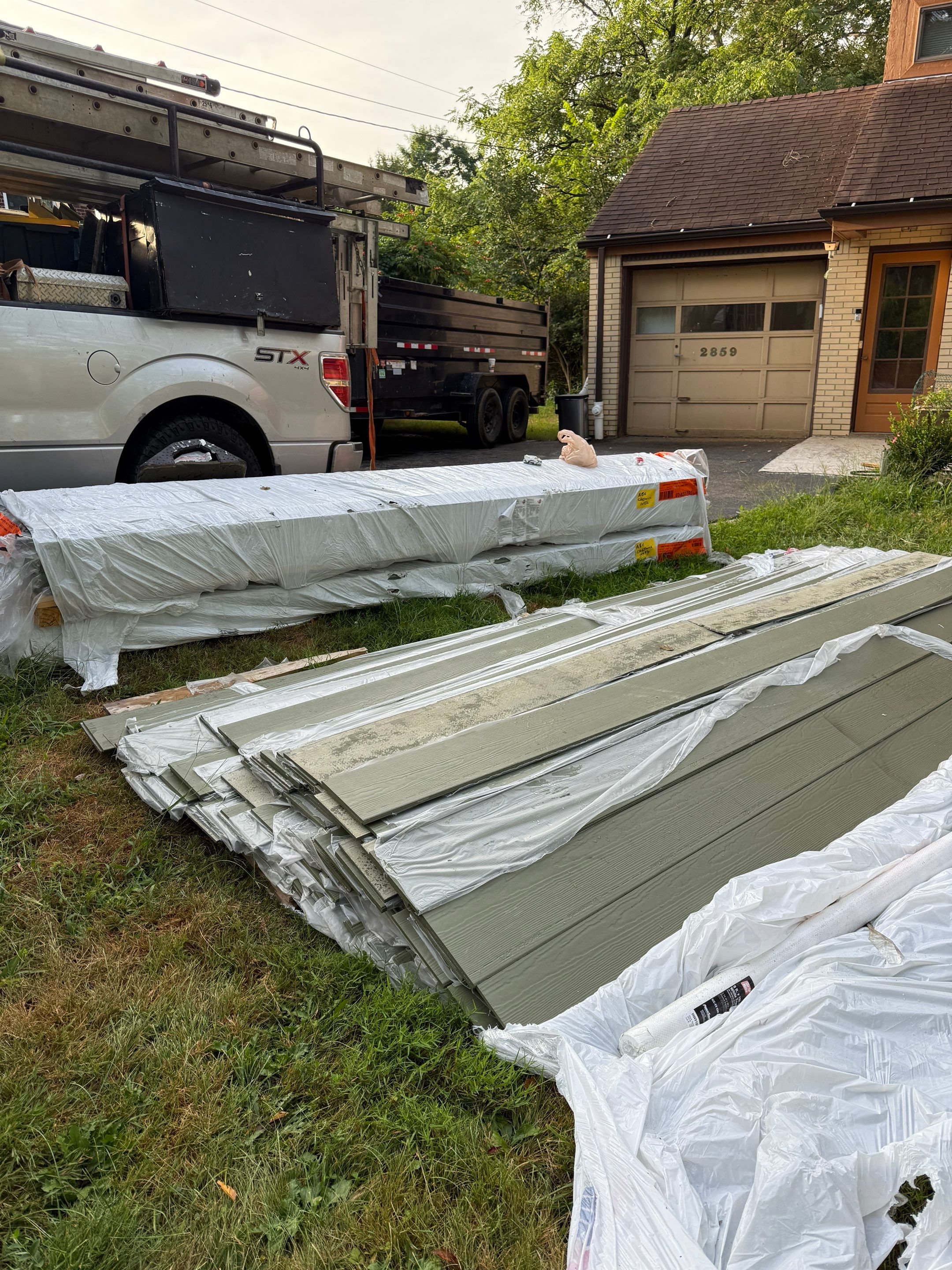 Hardie siding  by Cousins Roofing Siding & Decks